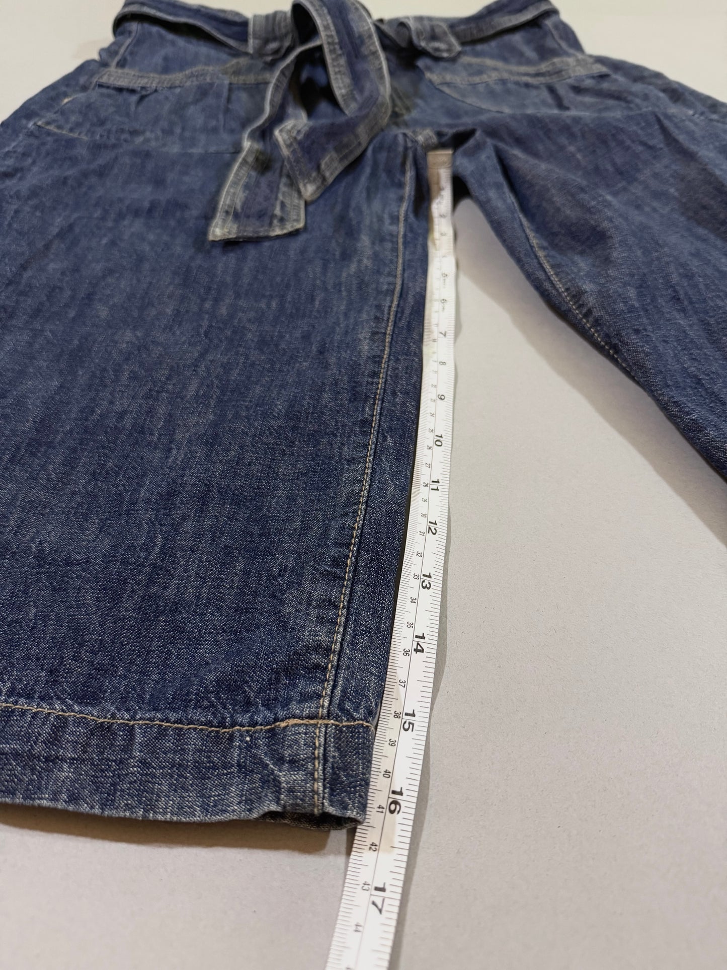 Outseam measurement displayed on wide-leg cropped pants.