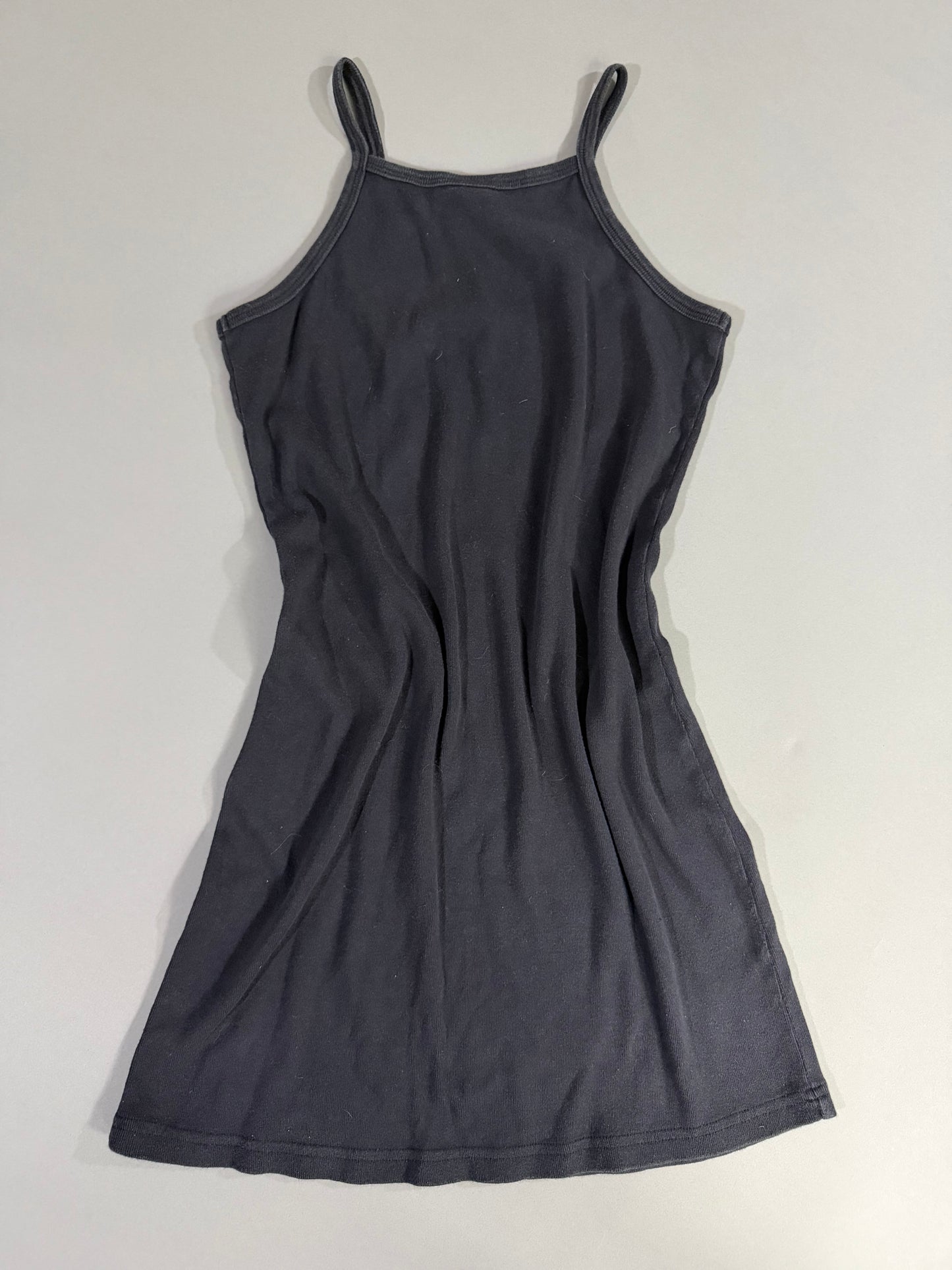 Back view of vintage Calvin Klein Jeans black fitted mini dress with clean minimalist silhouette.
