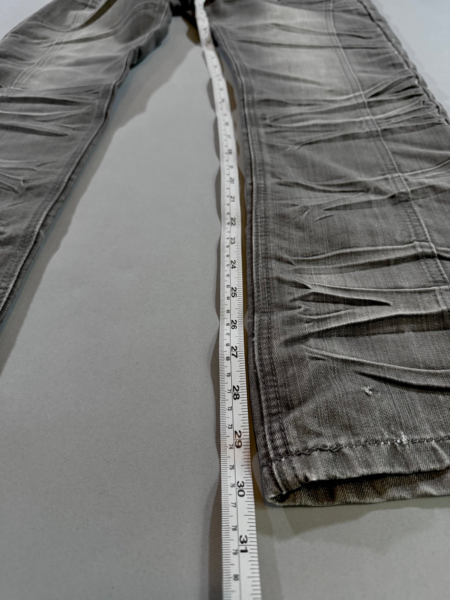Inseam measurement of the mid-2000s F.U.S.A.I. straight-leg jeans.