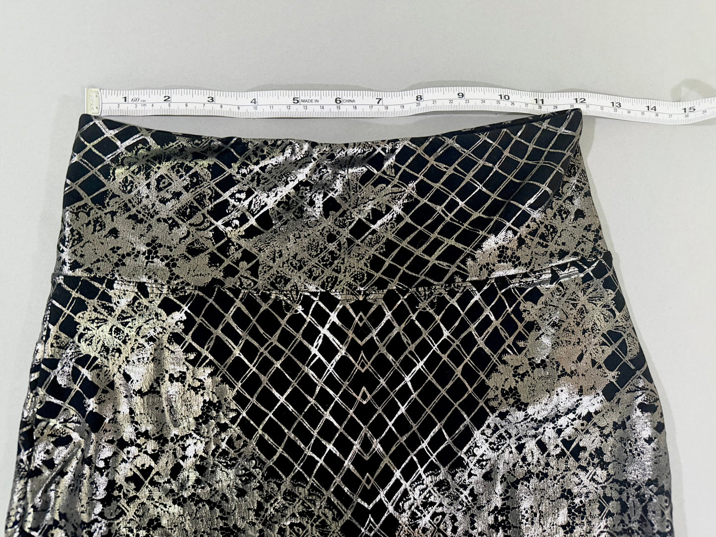 Waist measurement of Bebe metallic silver stretch mini skirt.