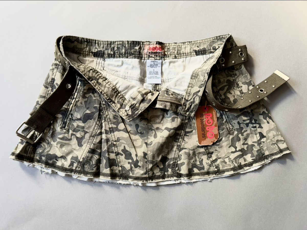 Photo of y2k camo mini skirt with original tags still attached and button fly open