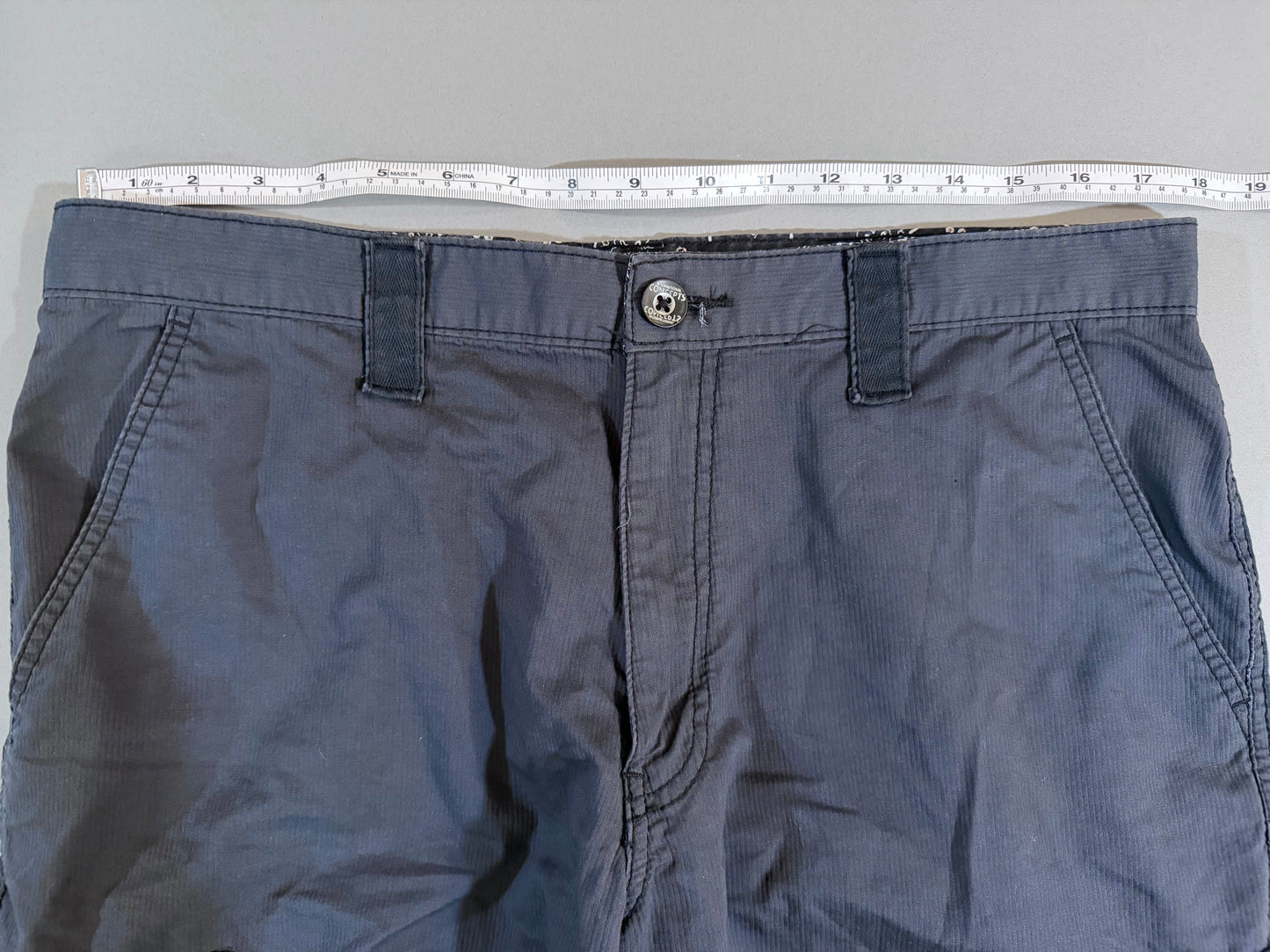 Waist measurement of International Concepts men’s size 34 cargo shorts.