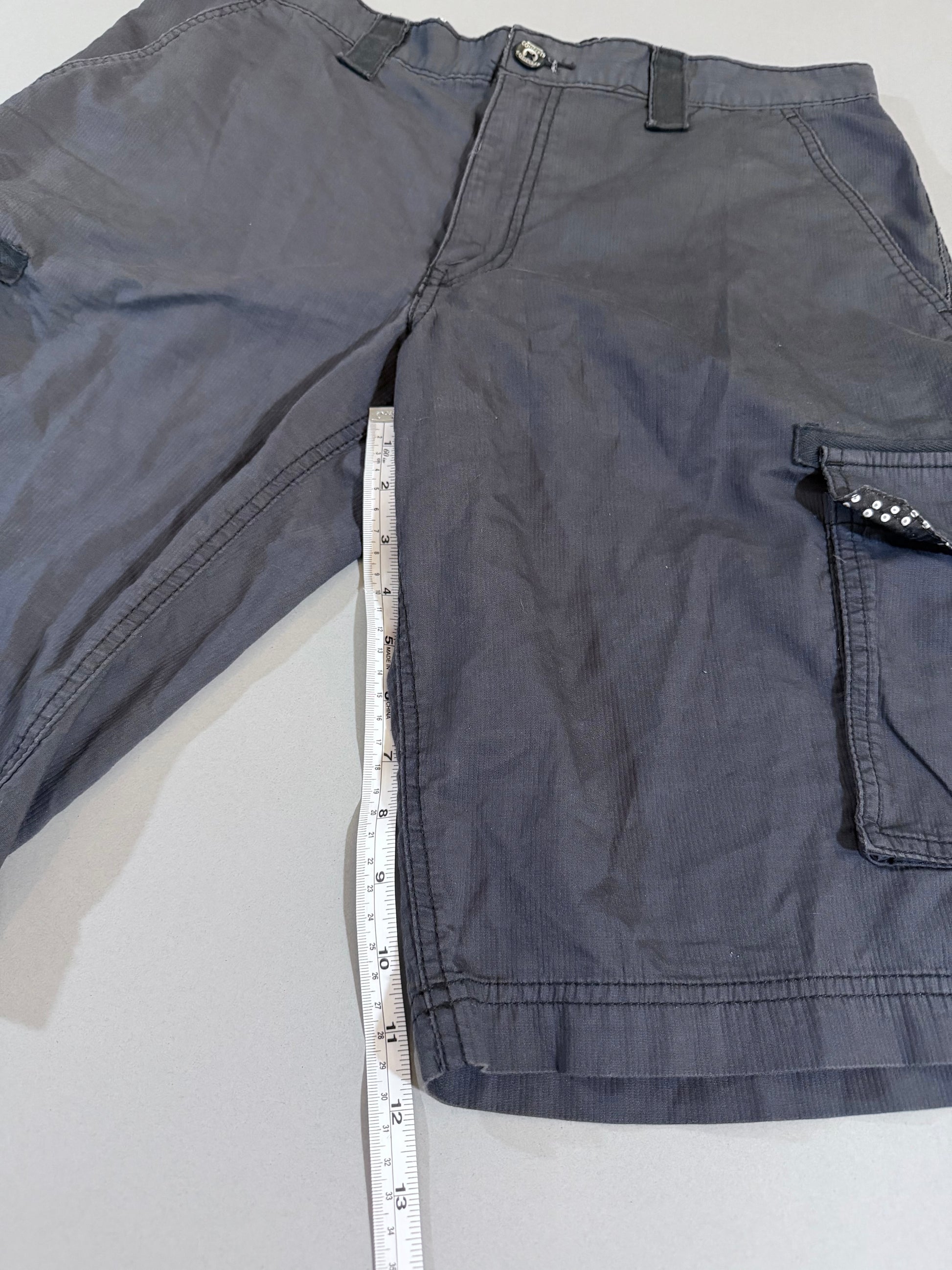 Inseam measurement of charcoal gray International Concepts cargo shorts.