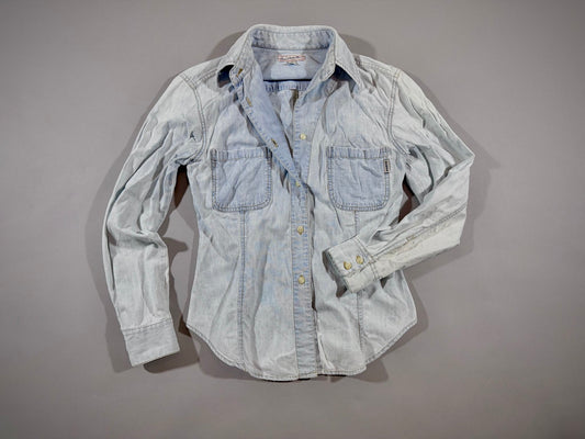 Vintage Guess Premium Wash light wash chambray button-up shirt front view with dual chest pockets.