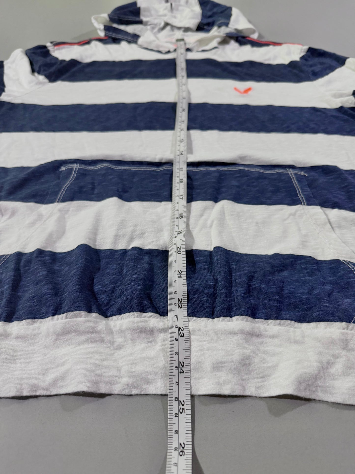 Close up of the length measurement on a navy & white striped American Eagle shirt from 2010. 