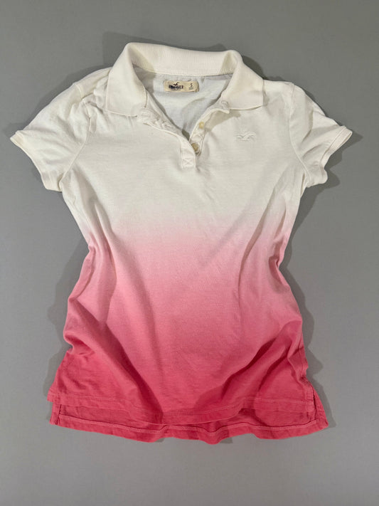 Hollister women’s white and pink ombré polo shirt with embroidered seagull logo, front view.