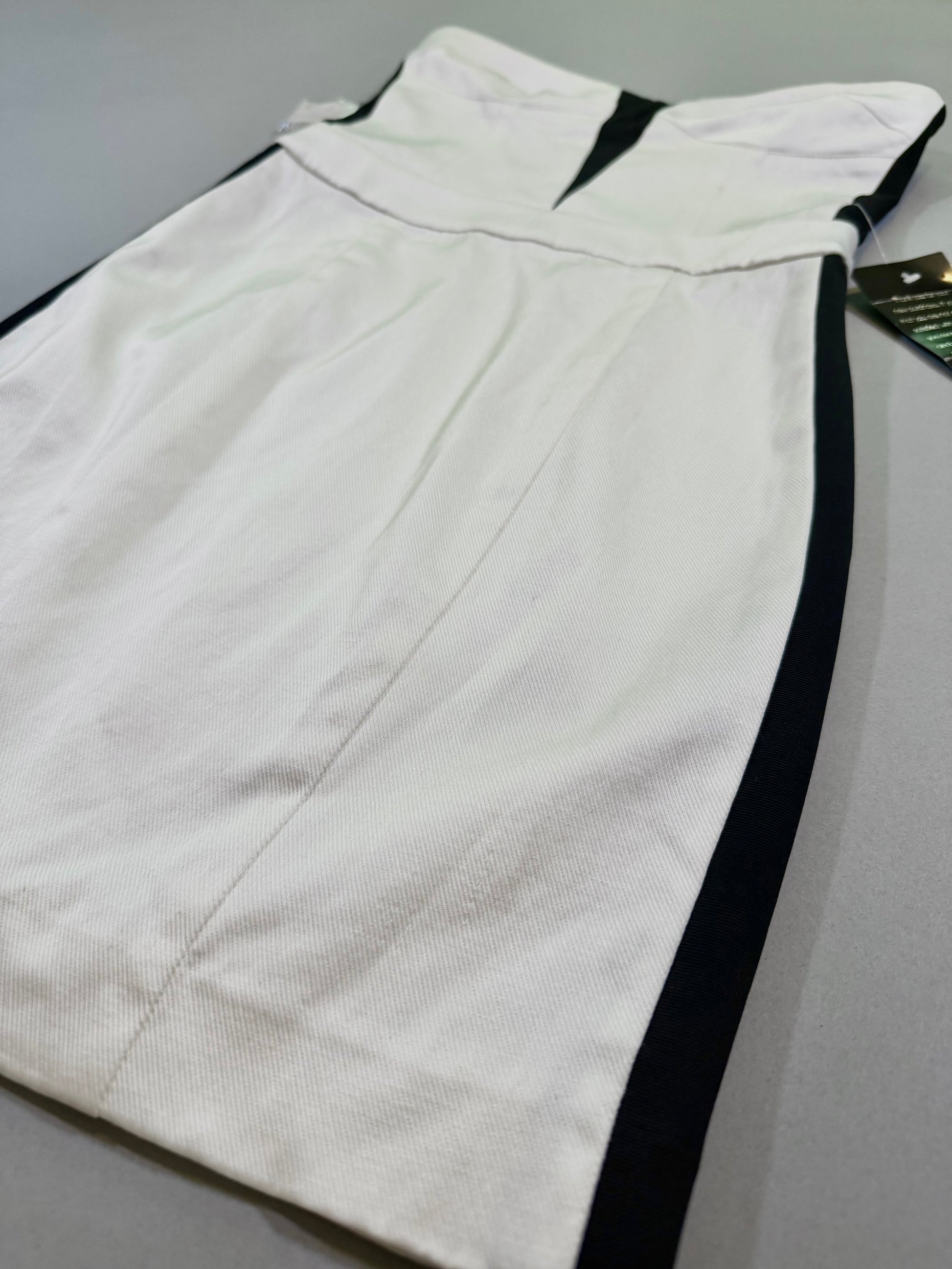 Angled photo of black and white dress showing quality fabric detail 