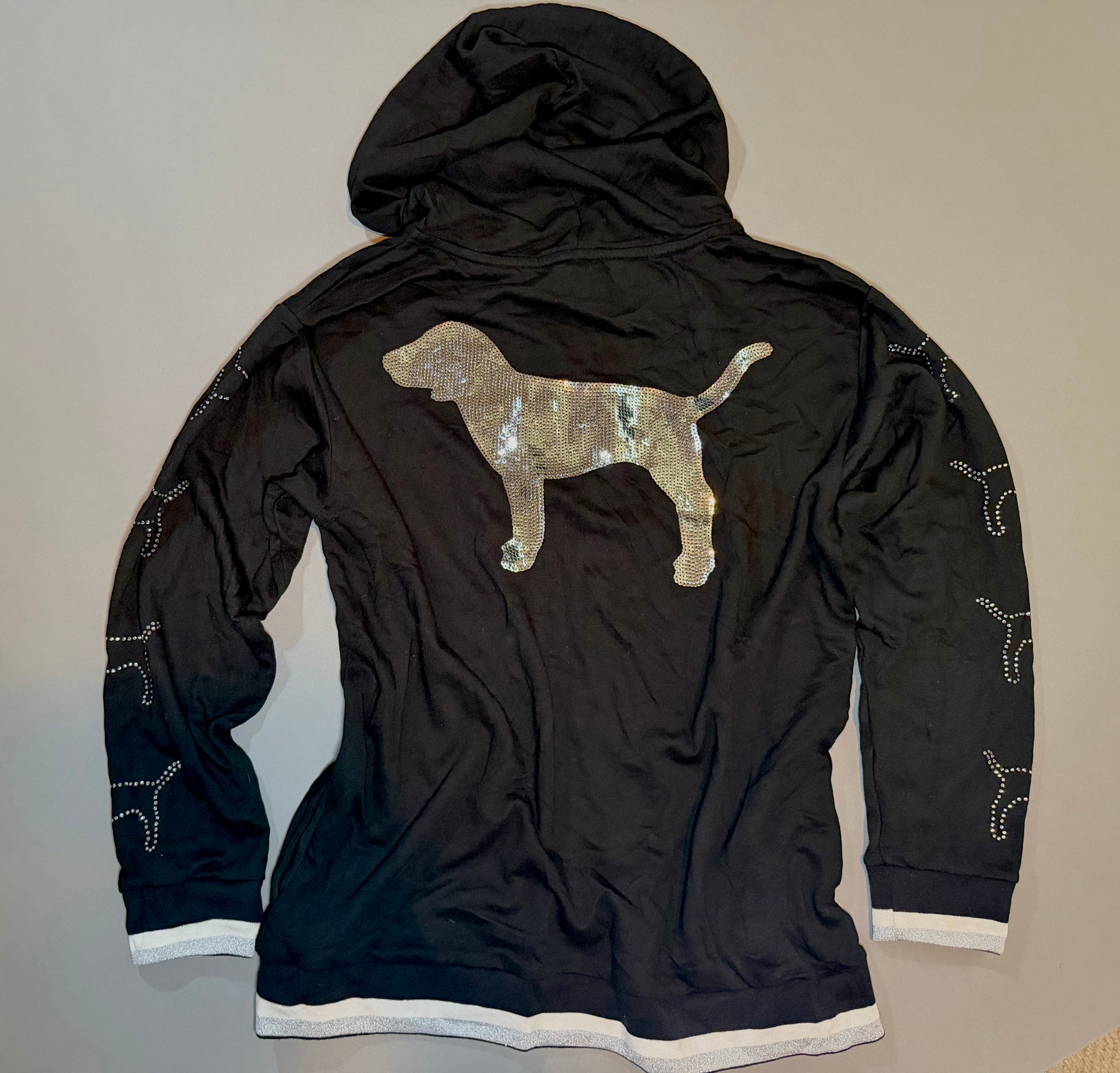 Back of the Victoria’s Secret PINK hoodie with oversized silver sequin dog graphic.