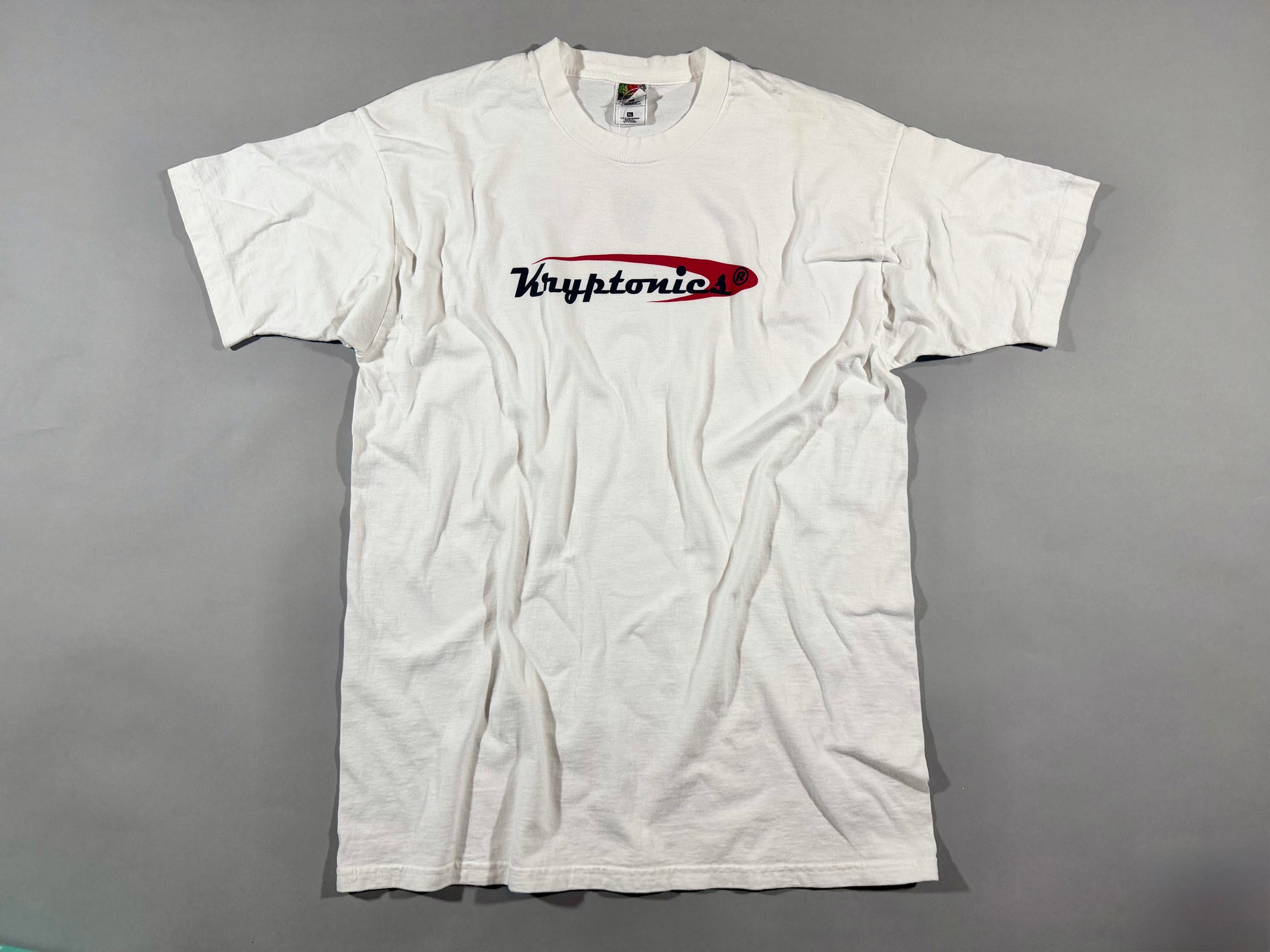 Vintage Kryptonics white logo T-shirt front view featuring red and black skateboard brand graphic.