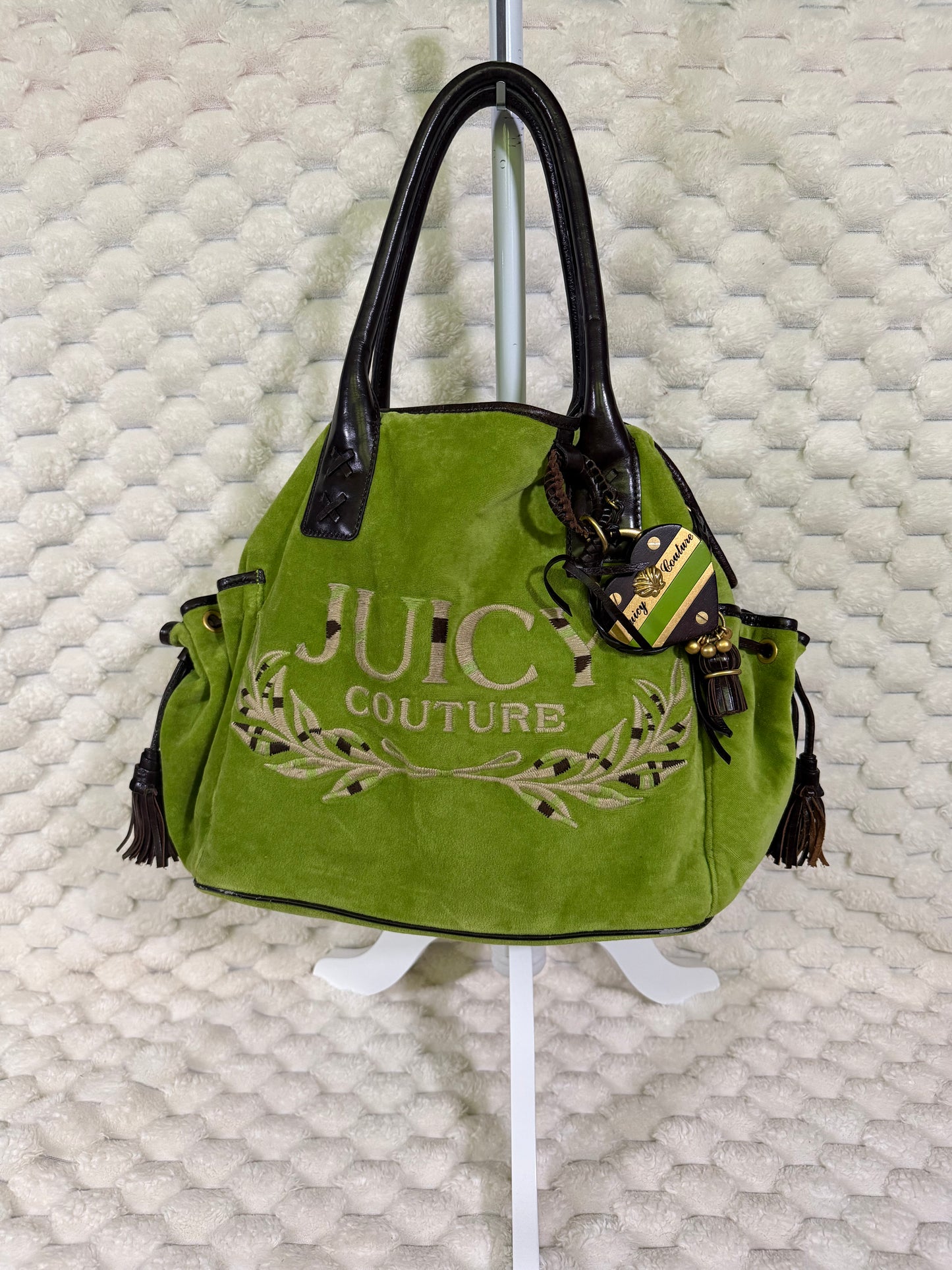Vintage Juicy Couture green velour Splendor shoulder tote with embroidered logo, brown handles and original heart charm.