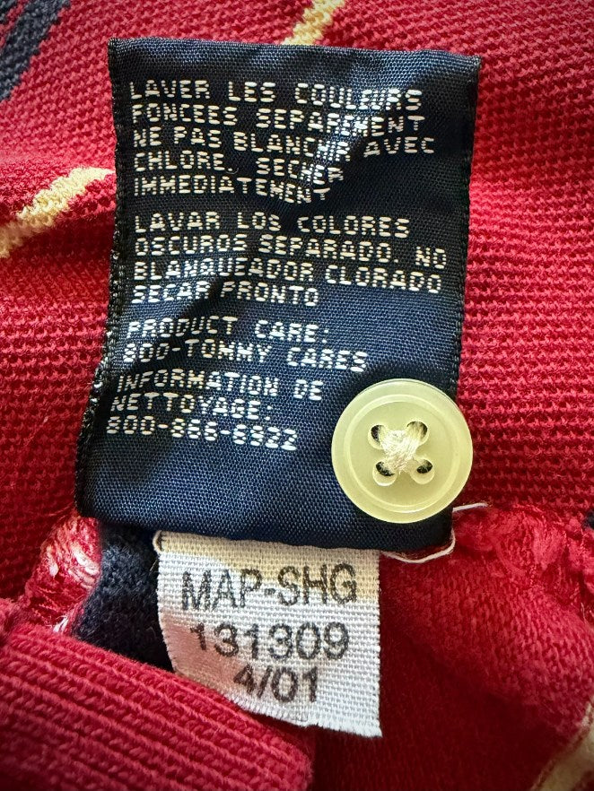 Back of care tag and smaller manufacturer code tag showing date of manufacture as April 2001. Extra button sewn on tag. 