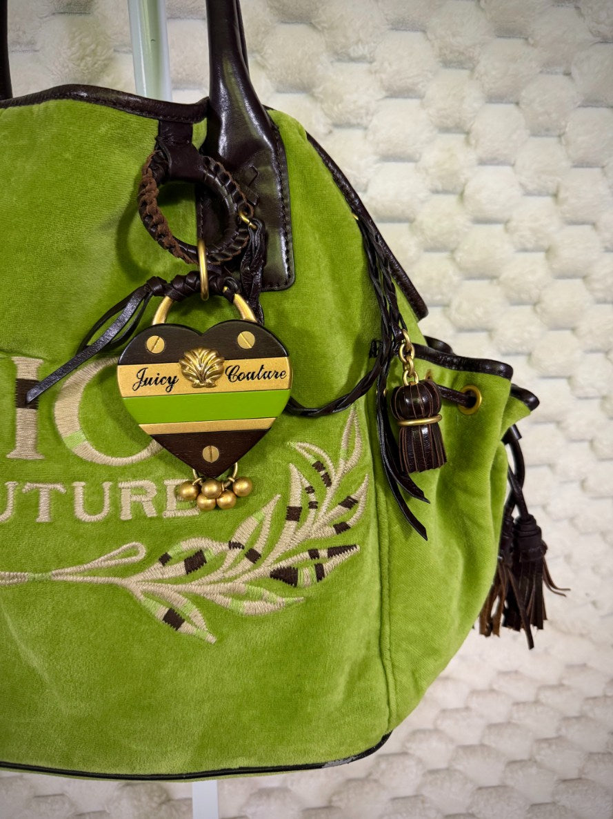 Vintage Juicy Couture heart bag charm in green, brown and gold with logo plaque, shell detail and dangling gold beads.