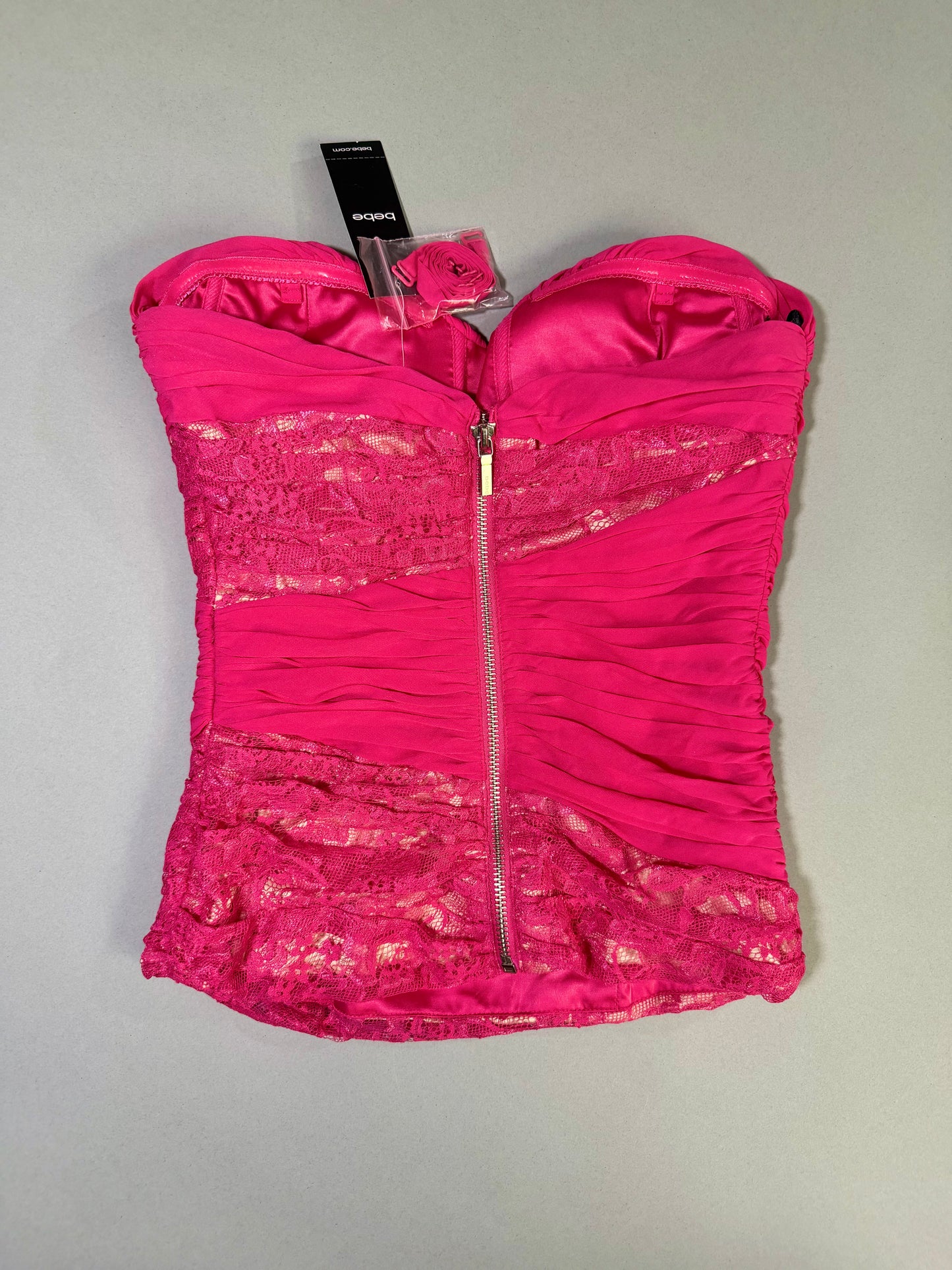 Back view highlighting the exposed silver zipper closure, ruched chiffon, and lace panel accents.