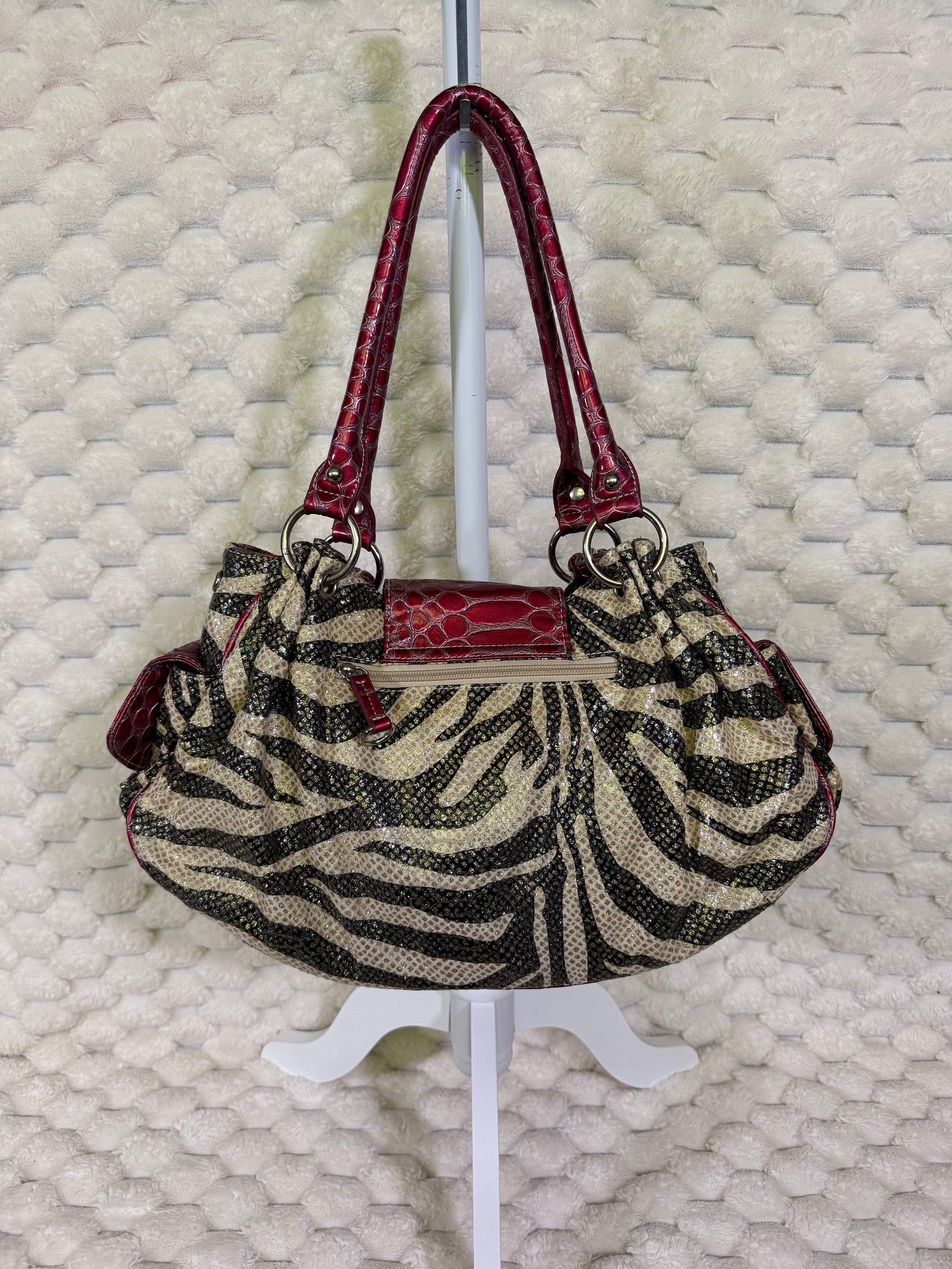 Back of Y2K zebra print shoulder bag with exterior zip pocket