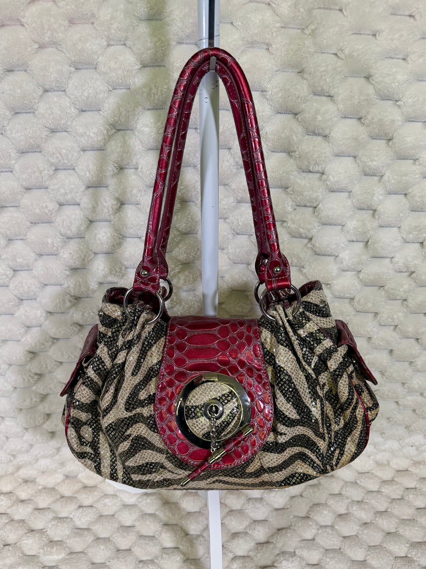 Y2K zebra print hobo shoulder bag with berry red crocodile embossed trim and oversized silver tone hardware.