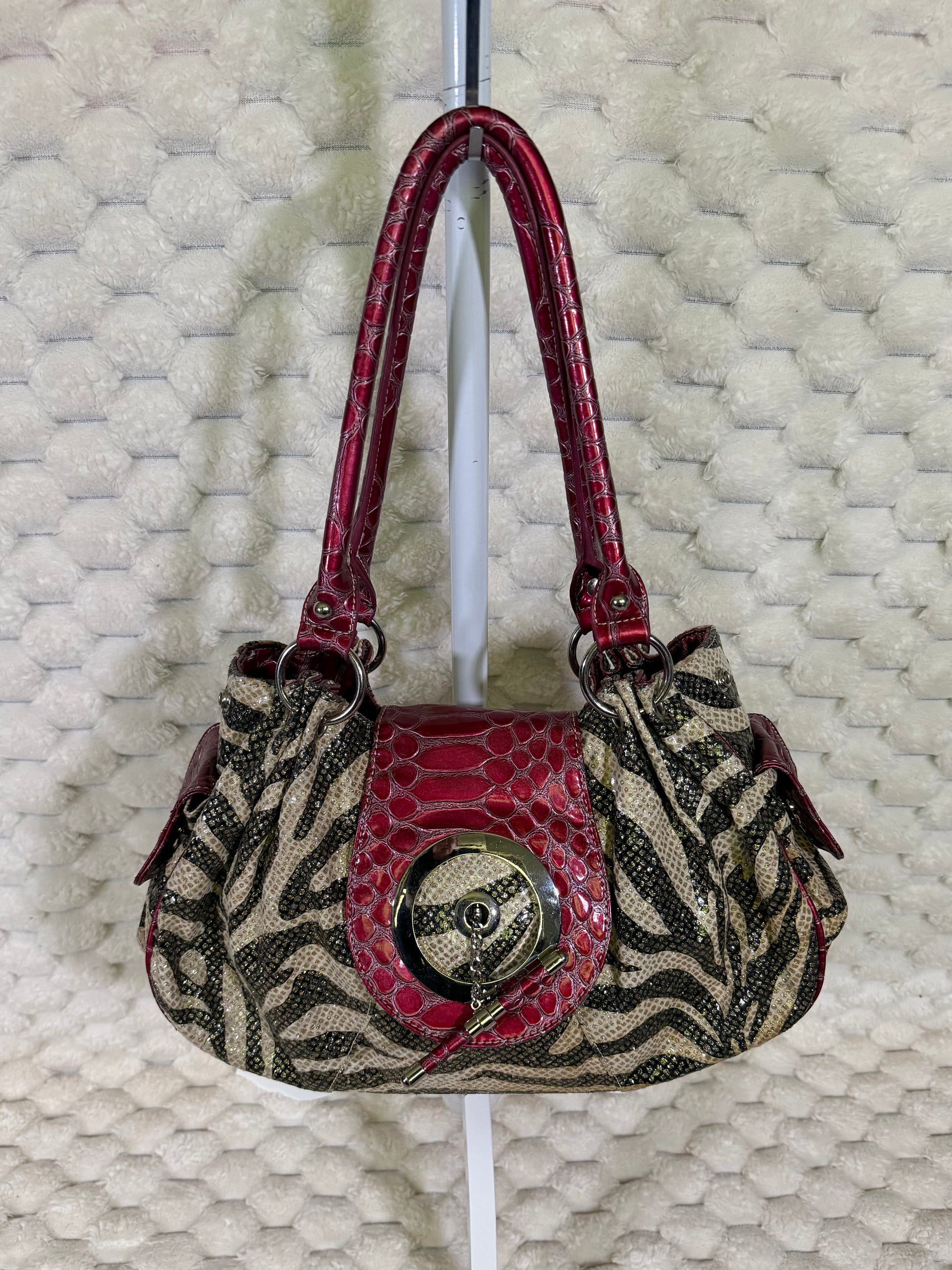 Y2K zebra print hobo shoulder bag with berry red crocodile embossed trim and oversized silver tone hardware.