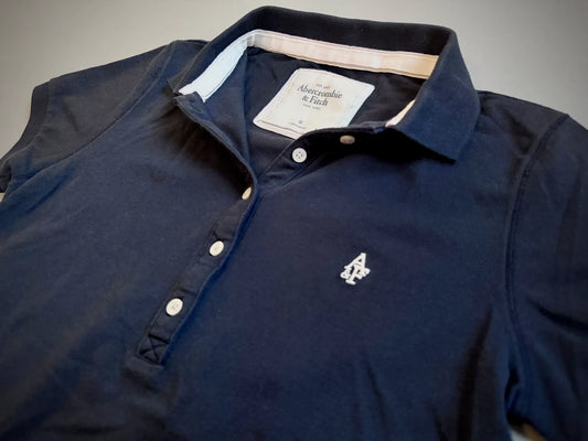 Close up of Abercrombie & Fitch polo collar and embroidered branding 