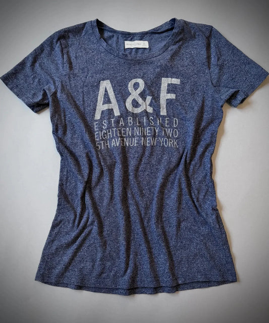 Navy blue Abercrombie & Fitch t-shirt with 'A&F' logo on a light gray background