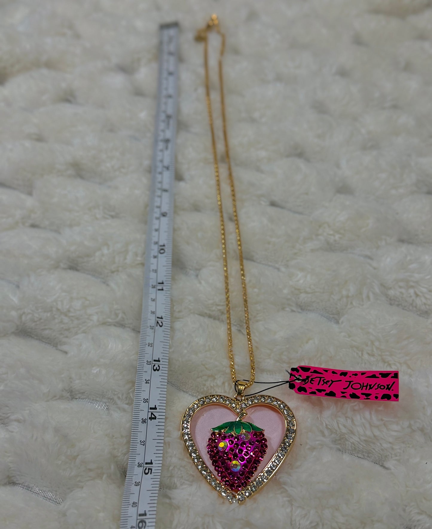 Betsey Johnson strawberry heart necklace shown beside a ruler displaying the approximate chain length.