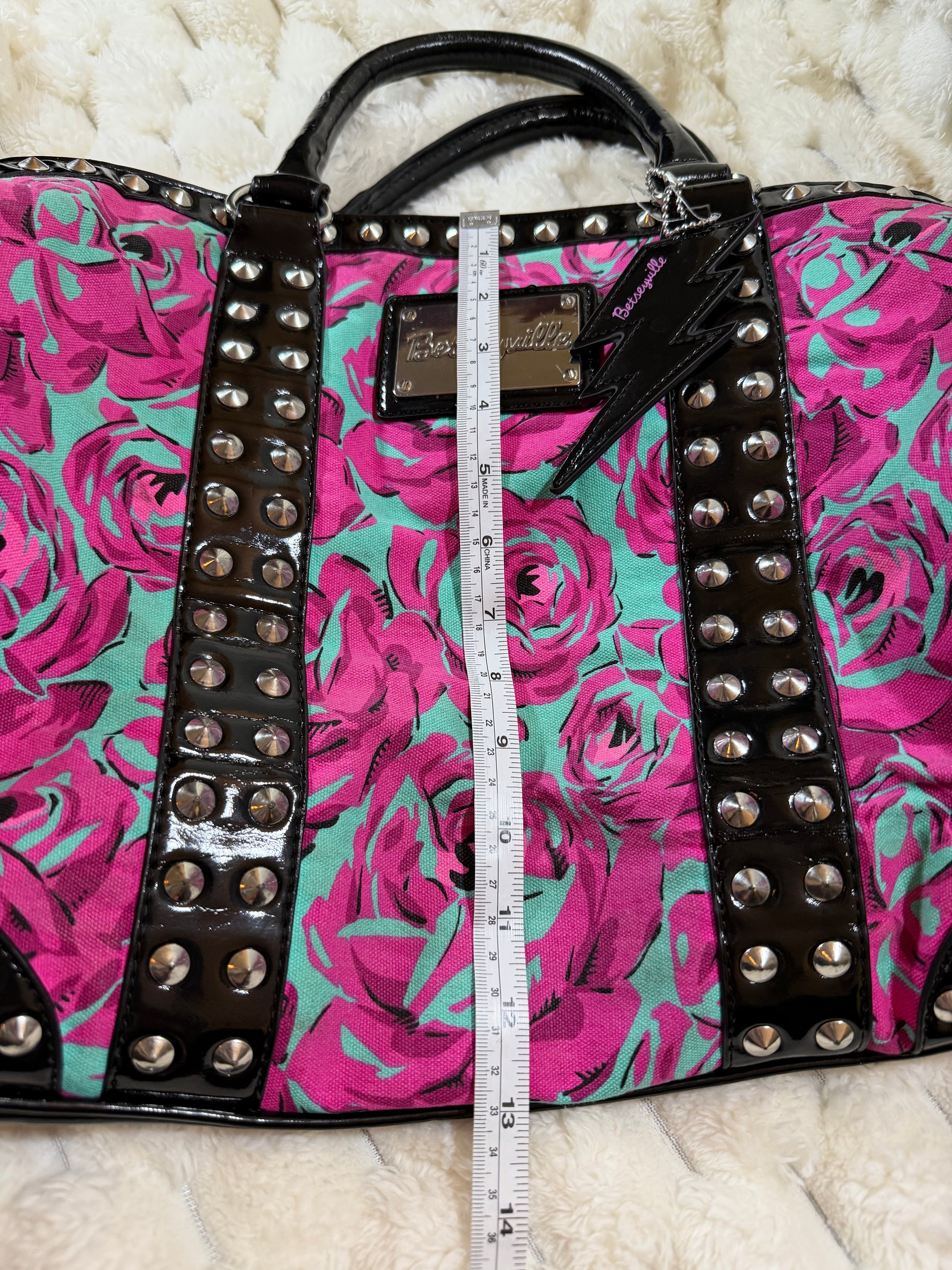 Height measurement of the Betseyville floral satchel shown with measuring tape, approximately 13 inches.