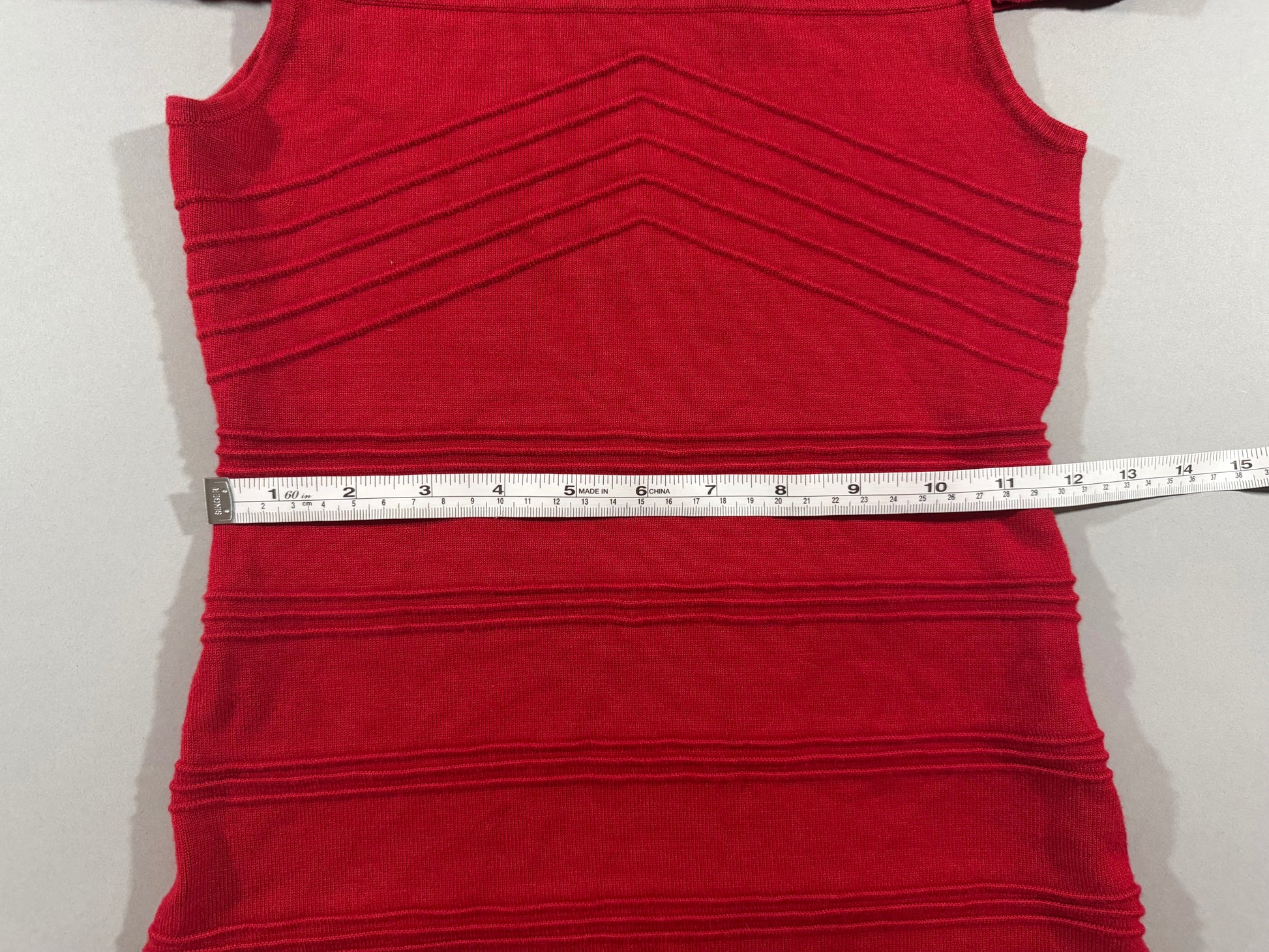 Waist measurement displayed across the ribbed knit Forever 21 bodycon sweater dress.
