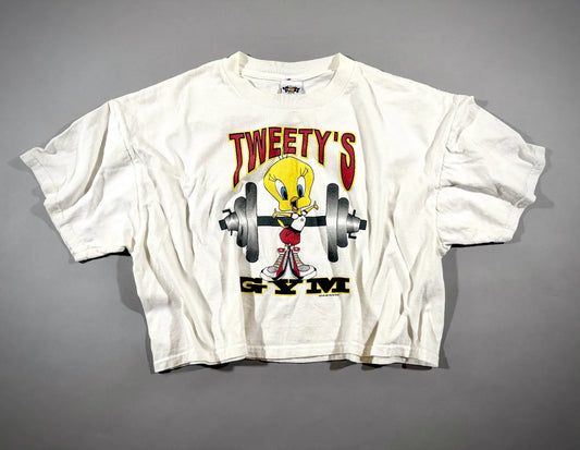 Vintage 1997 Tweety’s Gym Looney Tunes graphic T-shirt laid flat.