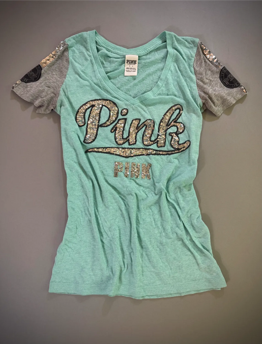 Y2k Victoria’s Secret PINK turquoise burnout V-neck T-shirt with silver sequin logo and gray varsity sleeves.