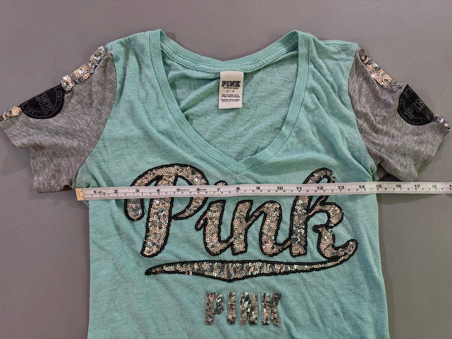 Victoria’s Secret PINK sequin logo T-shirt shown with pit-to-pit measurement.