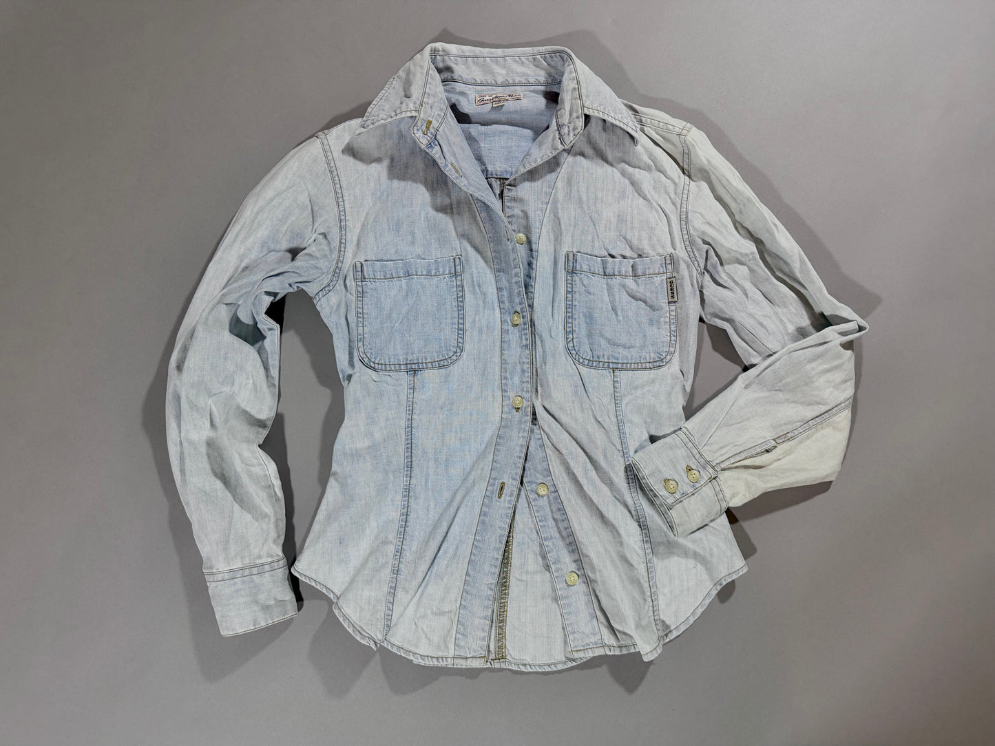 Vintage Guess light wash denim button-up shirt styled with an open front.