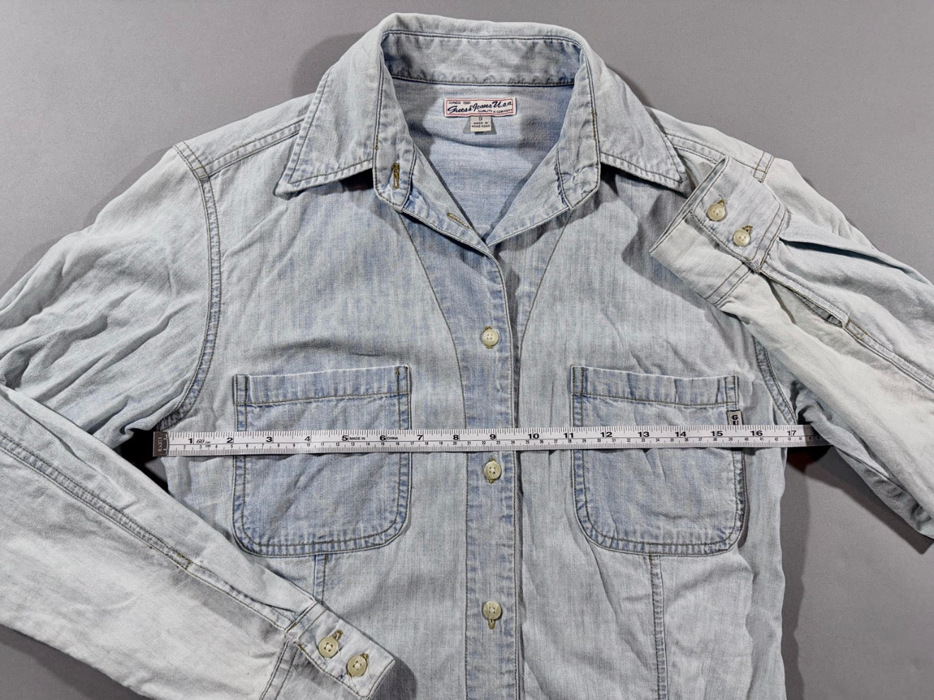 Vintage Guess Premium Wash light wash chambray denim shirt with pit-to-pit measurement shown across the chest.
