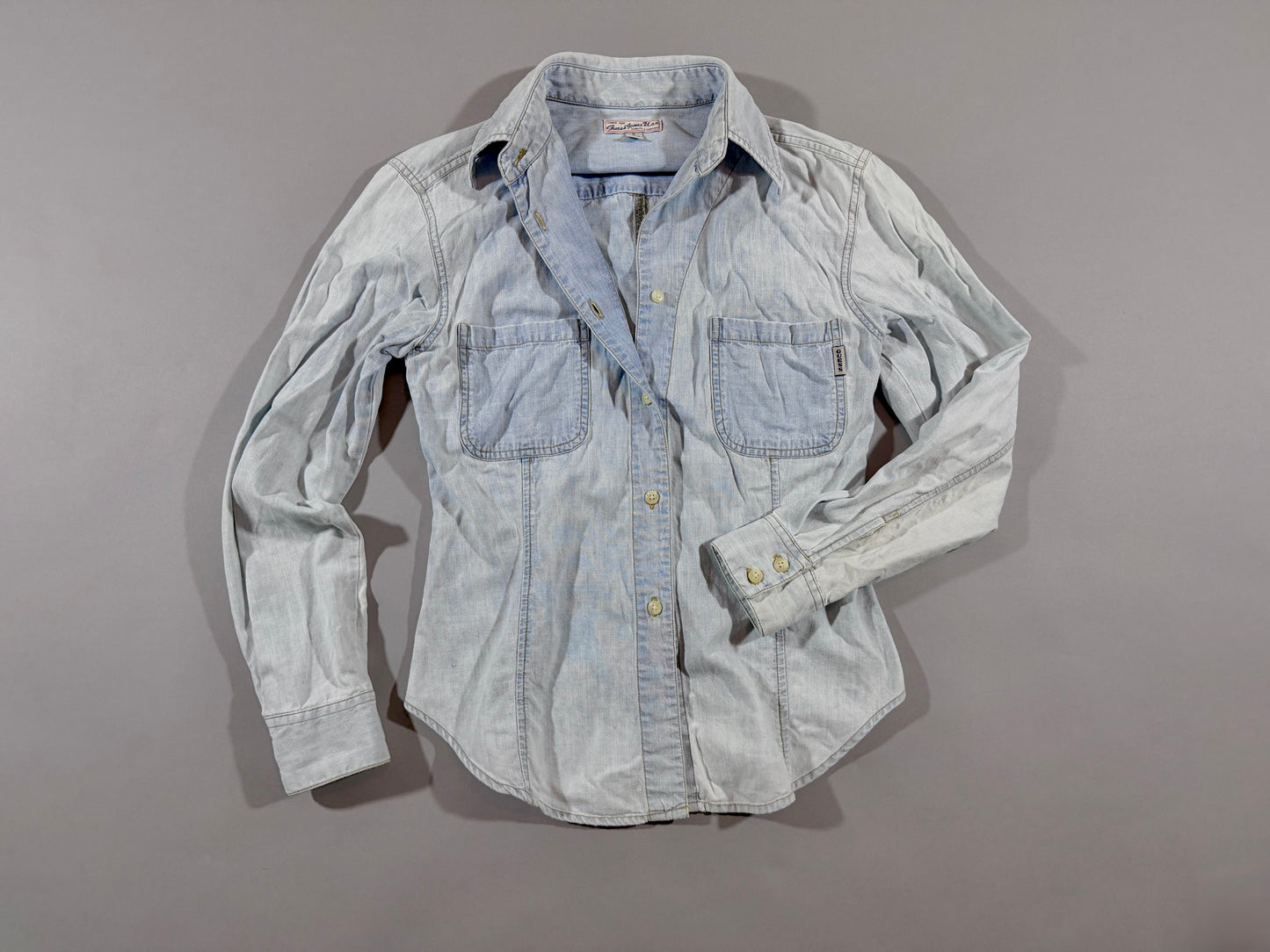 Vintage Guess Premium Wash light wash chambray button-up shirt front view with dual chest pockets.