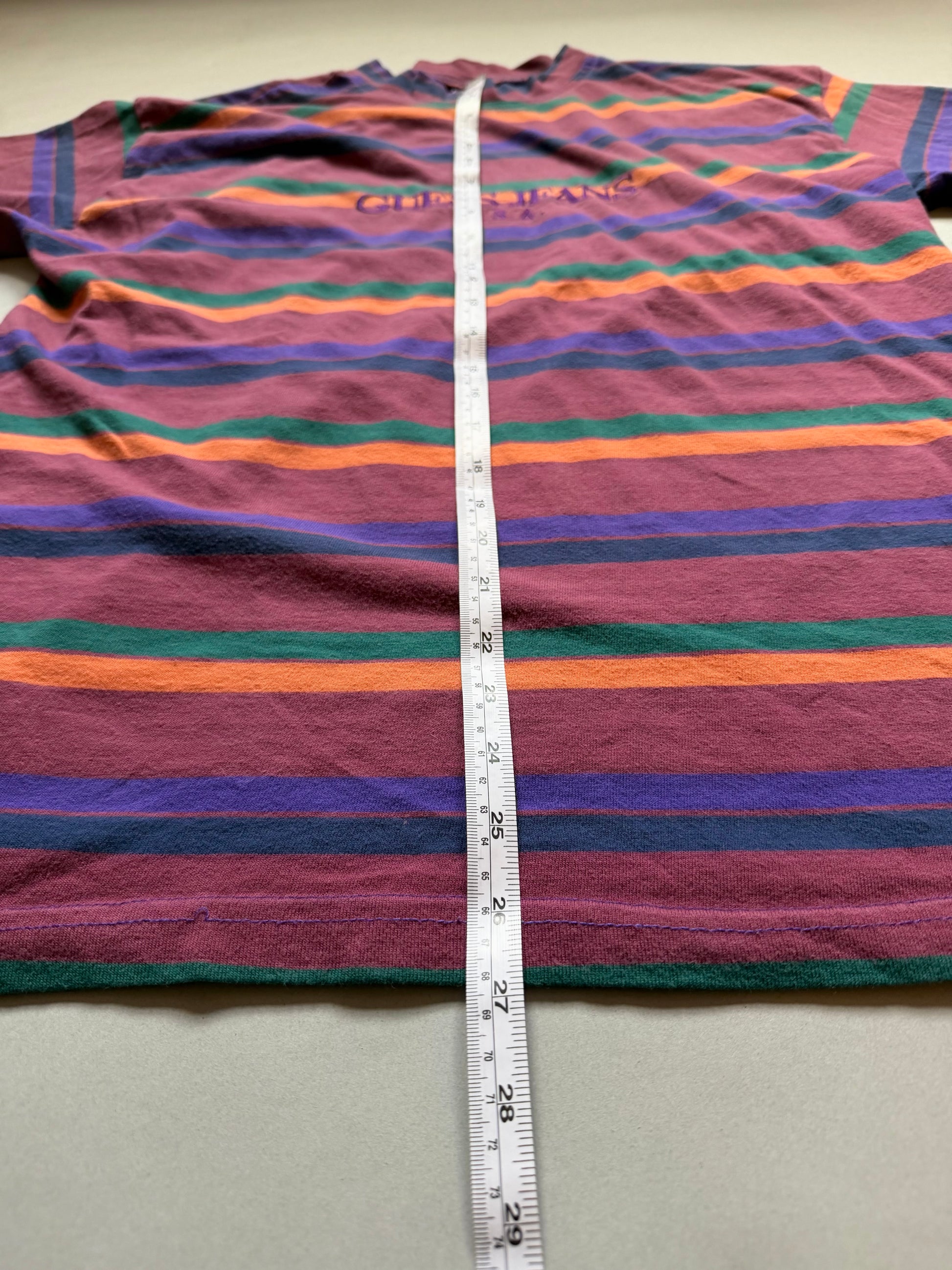 Vintage 90s striped Guess t-shirt with measuring tape showing 27 inches in length. 