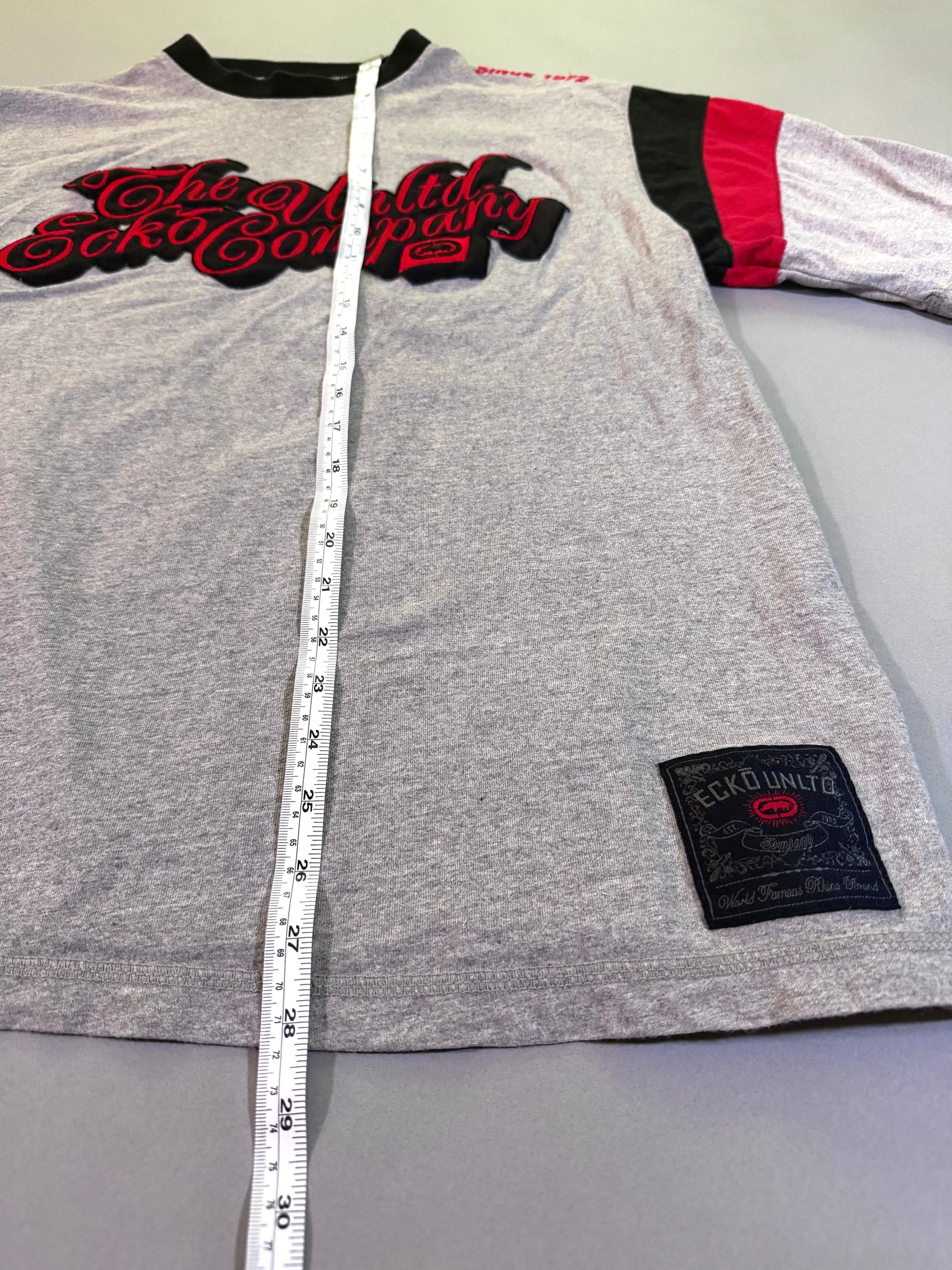Ecko Unltd t-shirt with measuring tape showing 28 inches length 