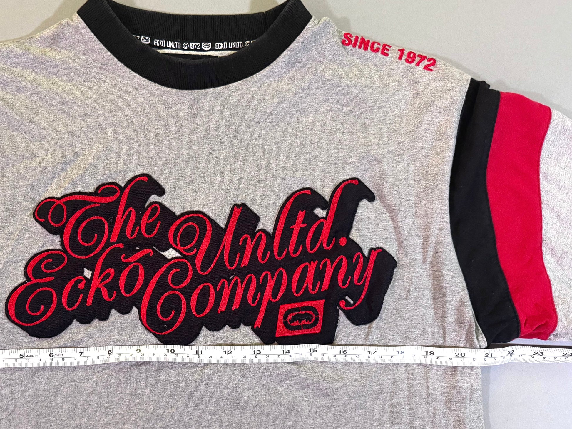 Vintage Ecko Unltd tee with measuring tape showing 21 inches pit to pit 