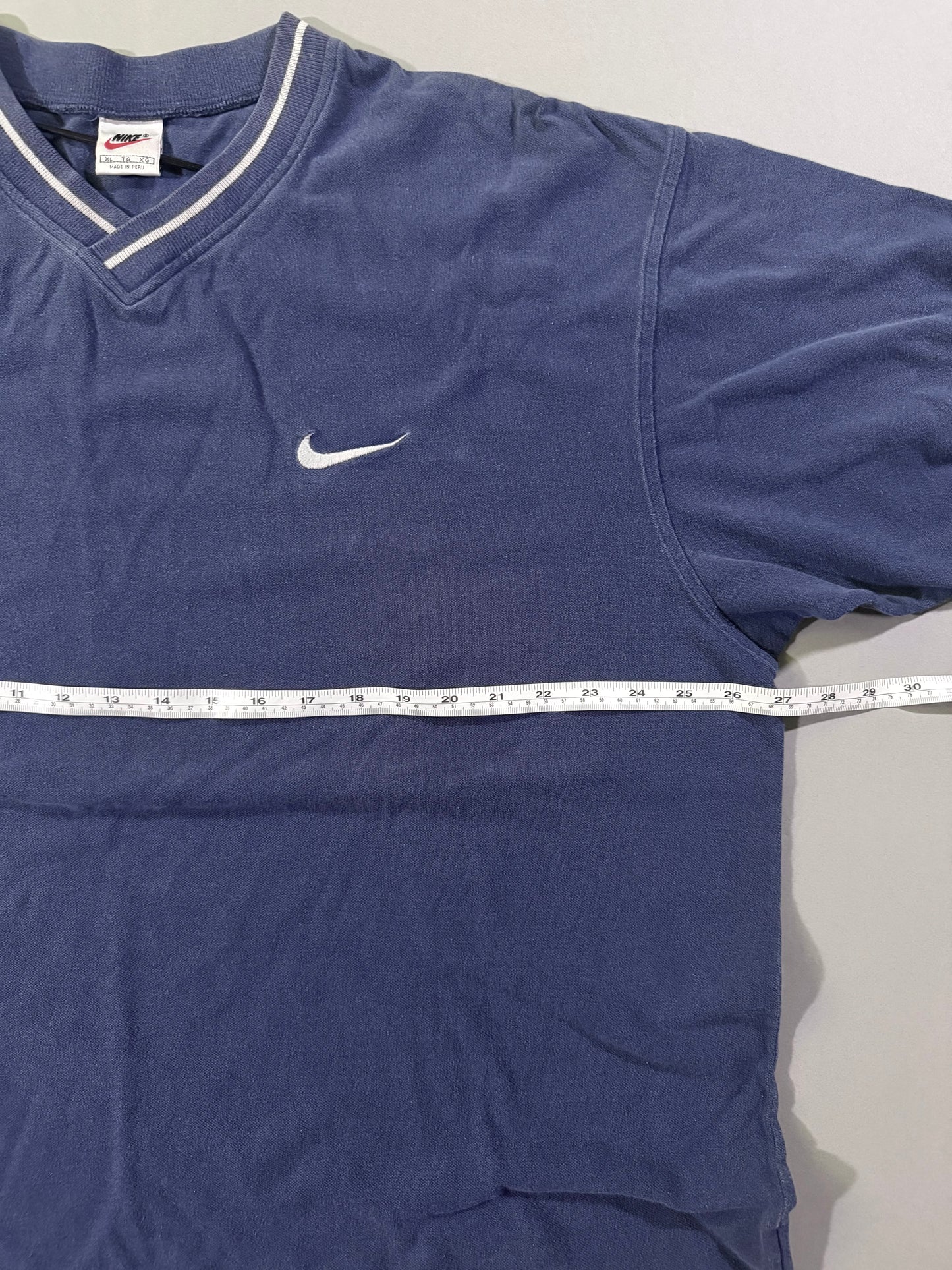 Chest measurement of vintage Nike embroidered Swoosh V-neck T-shirt.