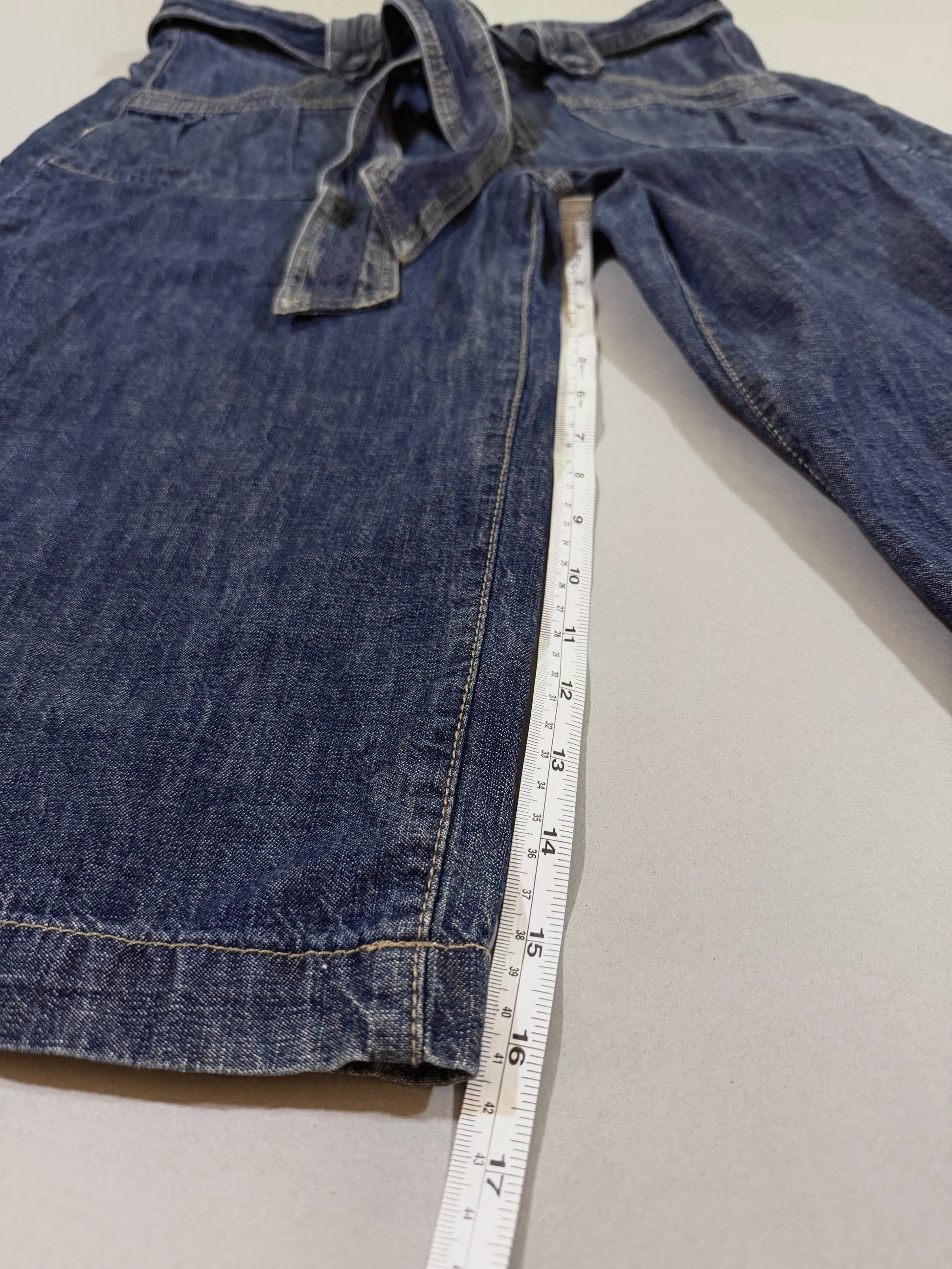 Outseam measurement displayed on wide-leg cropped pants.