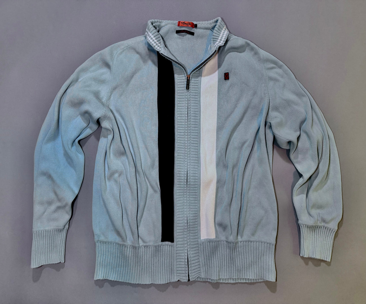 Vintage Marc Ecko Cut & Sew light blue full-zip knit cardigan with navy and white racing stripes on front.