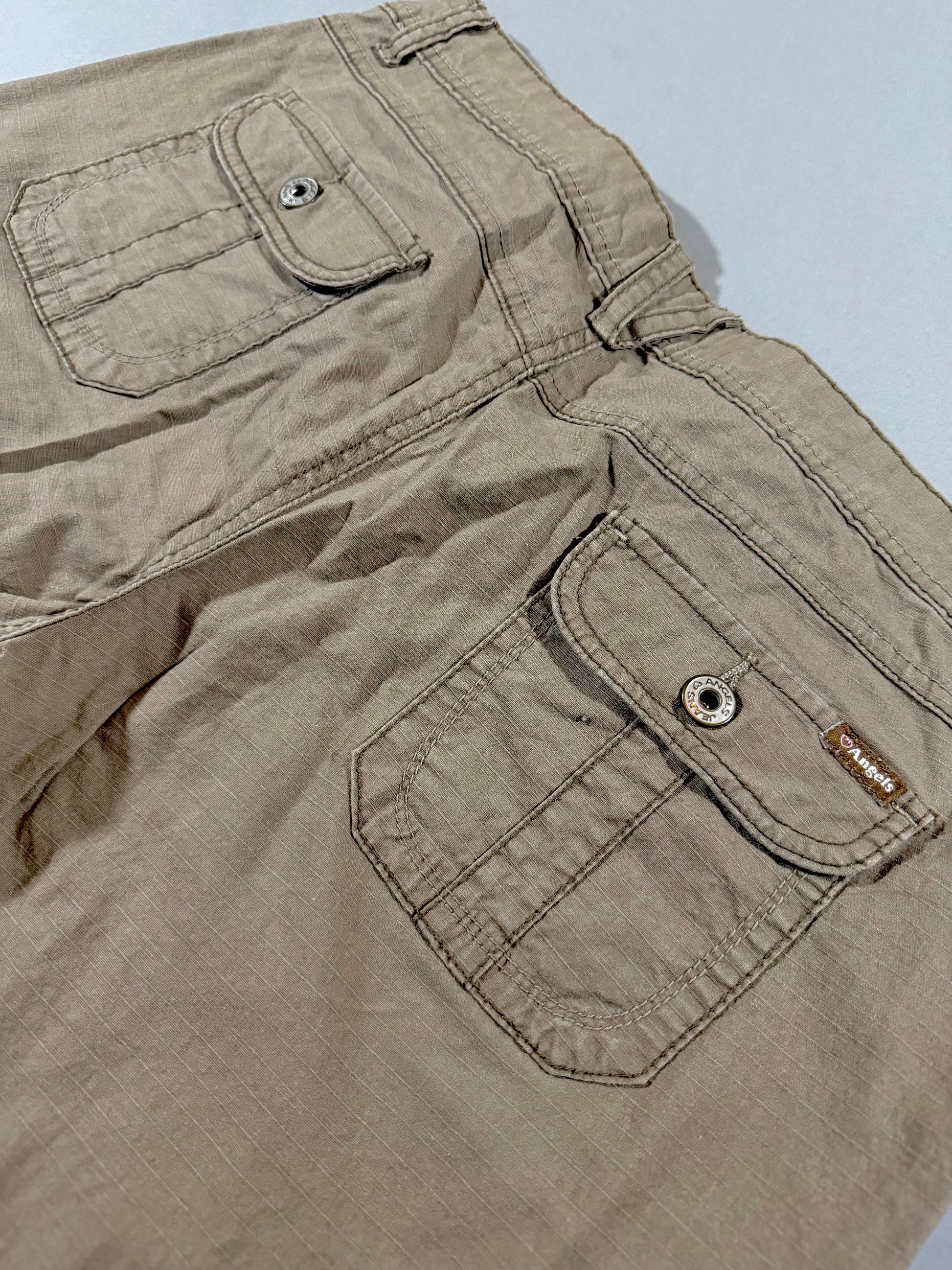 Close-up of back flap pockets and stitching details on vintage Angels Jeans capri pants.