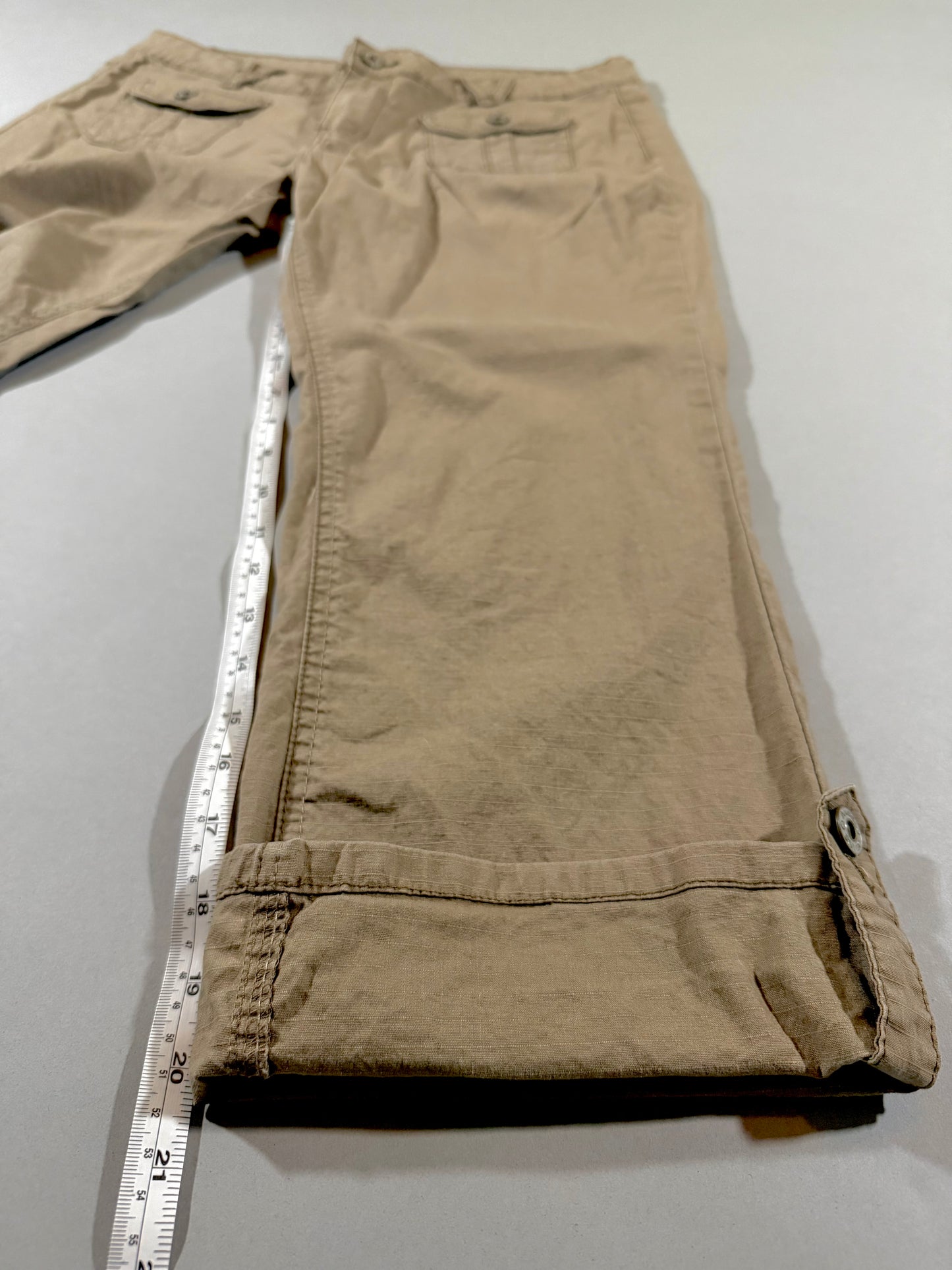 Side view showing cuffed hem and approximate inseam measurement of Angels Jeans khaki capris.