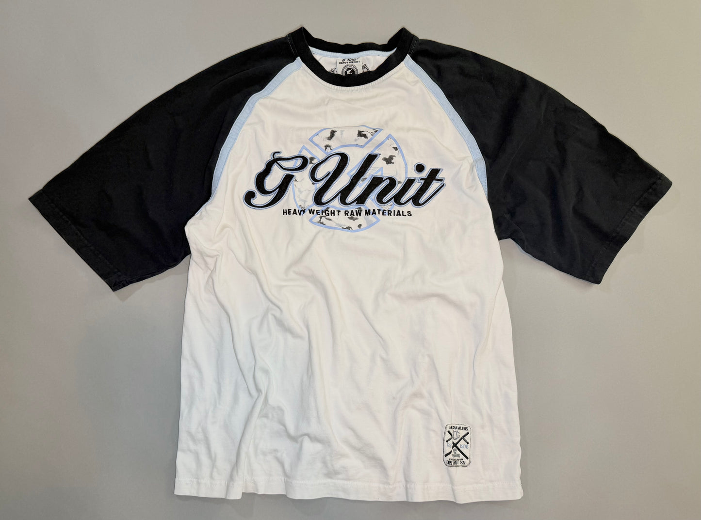 Vintage G-Unit white raglan T-shirt with black sleeves and embroidered Heavy Weight Raw Materials logo.