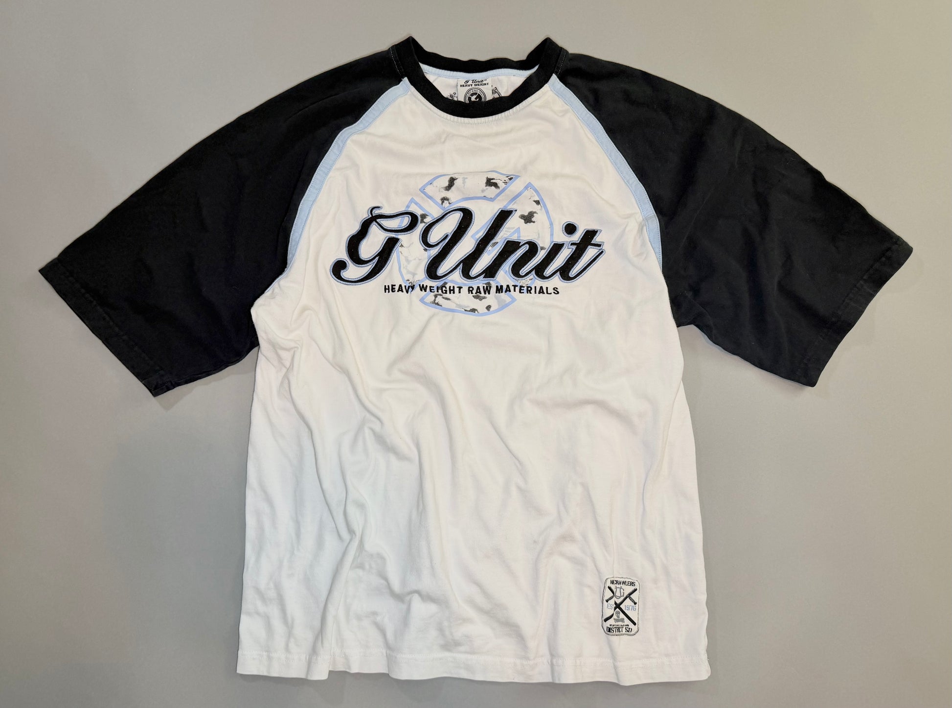 Vintage G-Unit white raglan T-shirt with black sleeves and embroidered Heavy Weight Raw Materials logo.