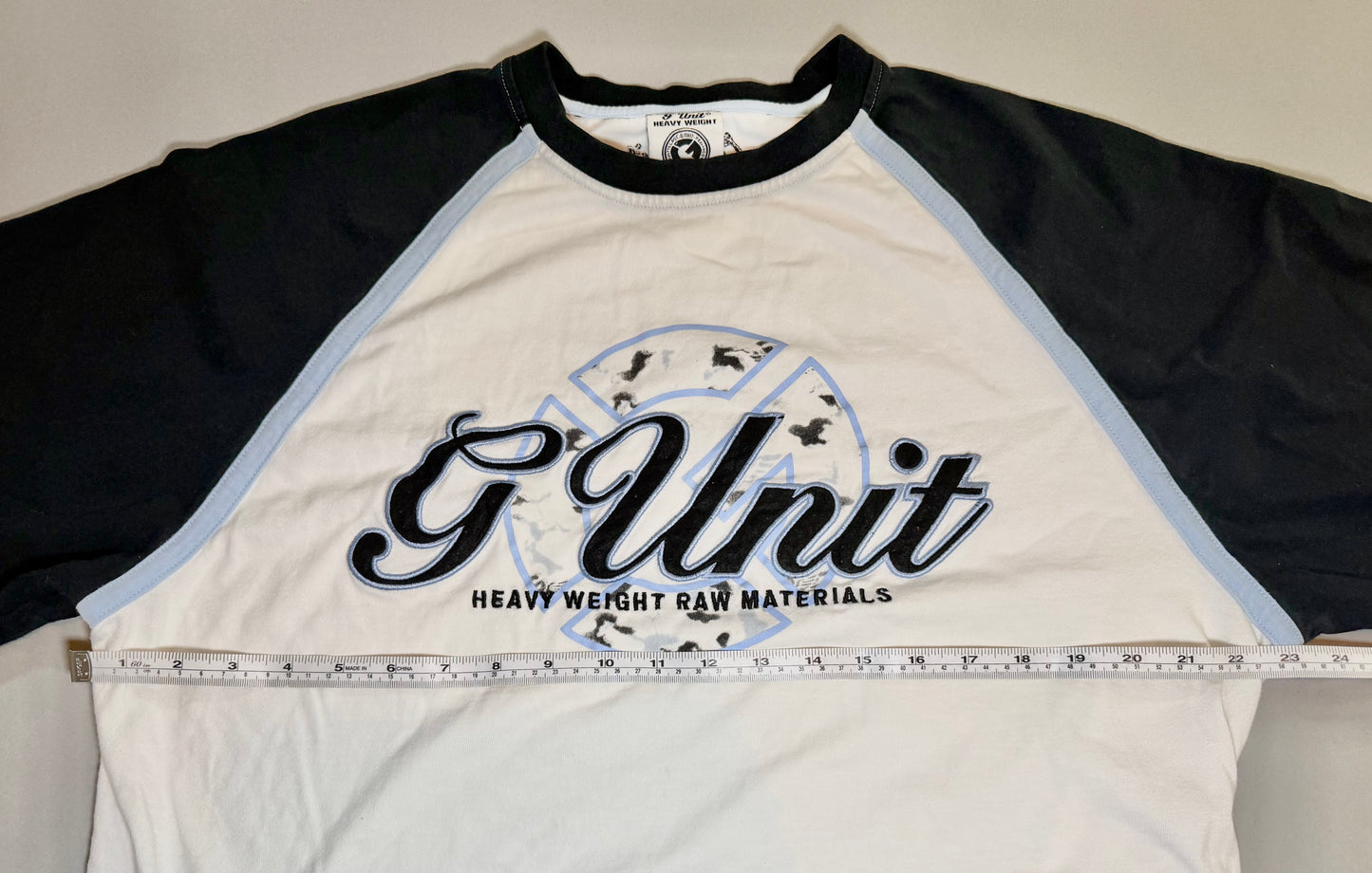 Front measurement photo showing pit-to-pit width of the vintage G-Unit raglan tee.