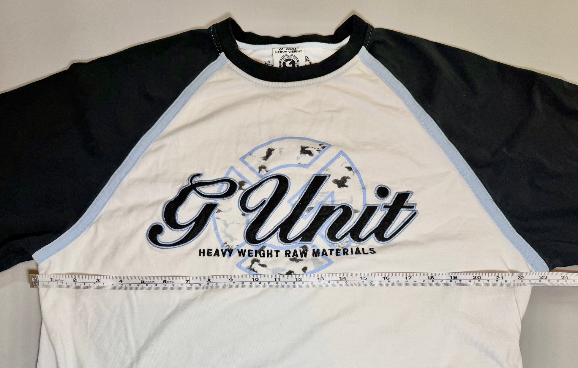 Front measurement photo showing pit-to-pit width of the vintage G-Unit raglan tee.