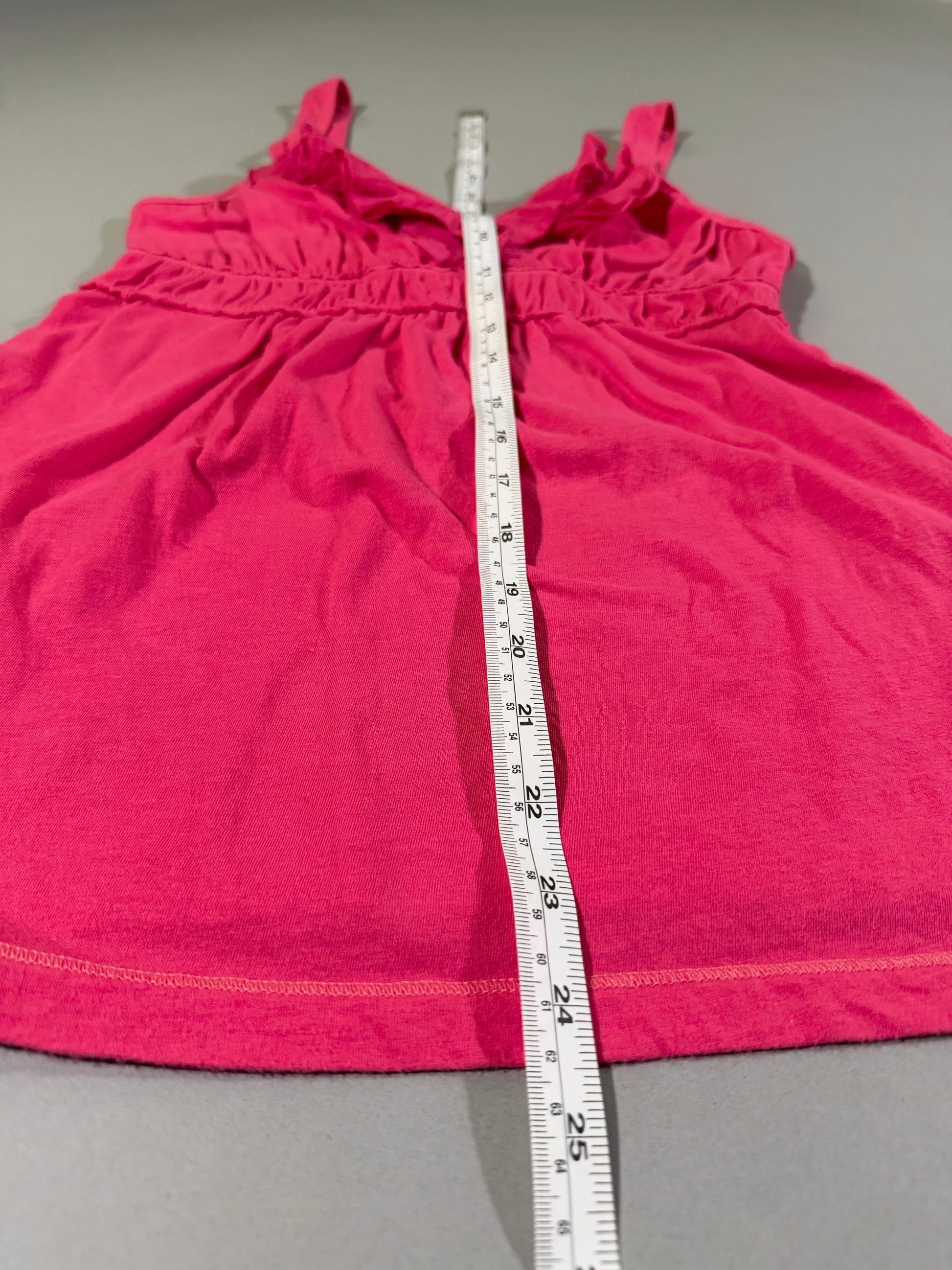 Length measurement shown down the front of the vintage coral pink Hollister babydoll tank top.