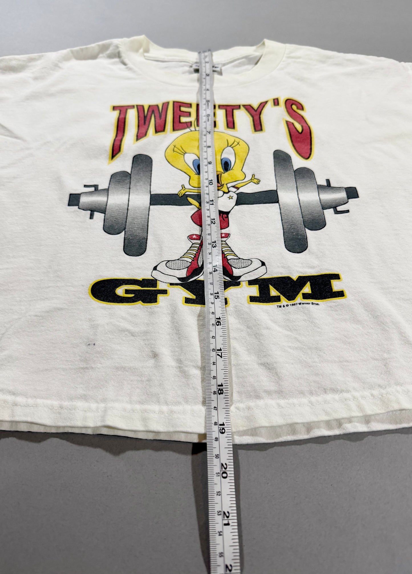 Front view showing shirt length measurement on vintage Looney Tunes T-shirt.