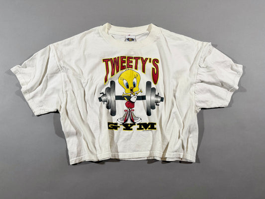 Vintage 1997 Tweety’s Gym Looney Tunes graphic T-shirt laid flat.