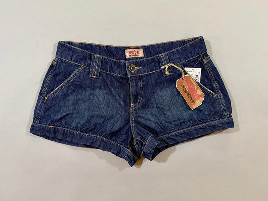 NWT 2007 Nobo No Boundaries dark wash denim shorts laid flat with original hang tag attached.