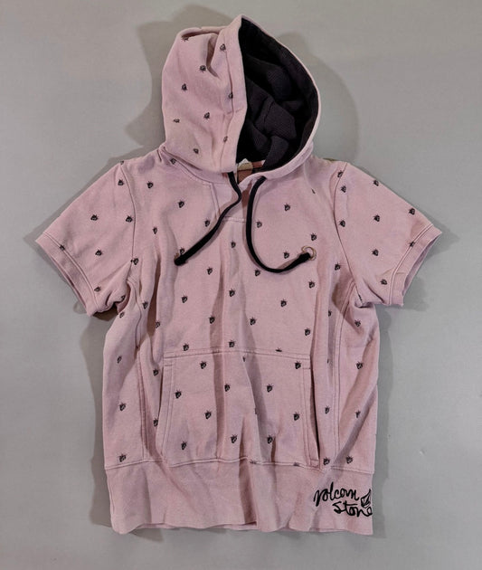 Vintage pink Volcom short sleeve hoodie with all-over berry Stone logo print, kangaroo pocket, and black waffle-lined hood.