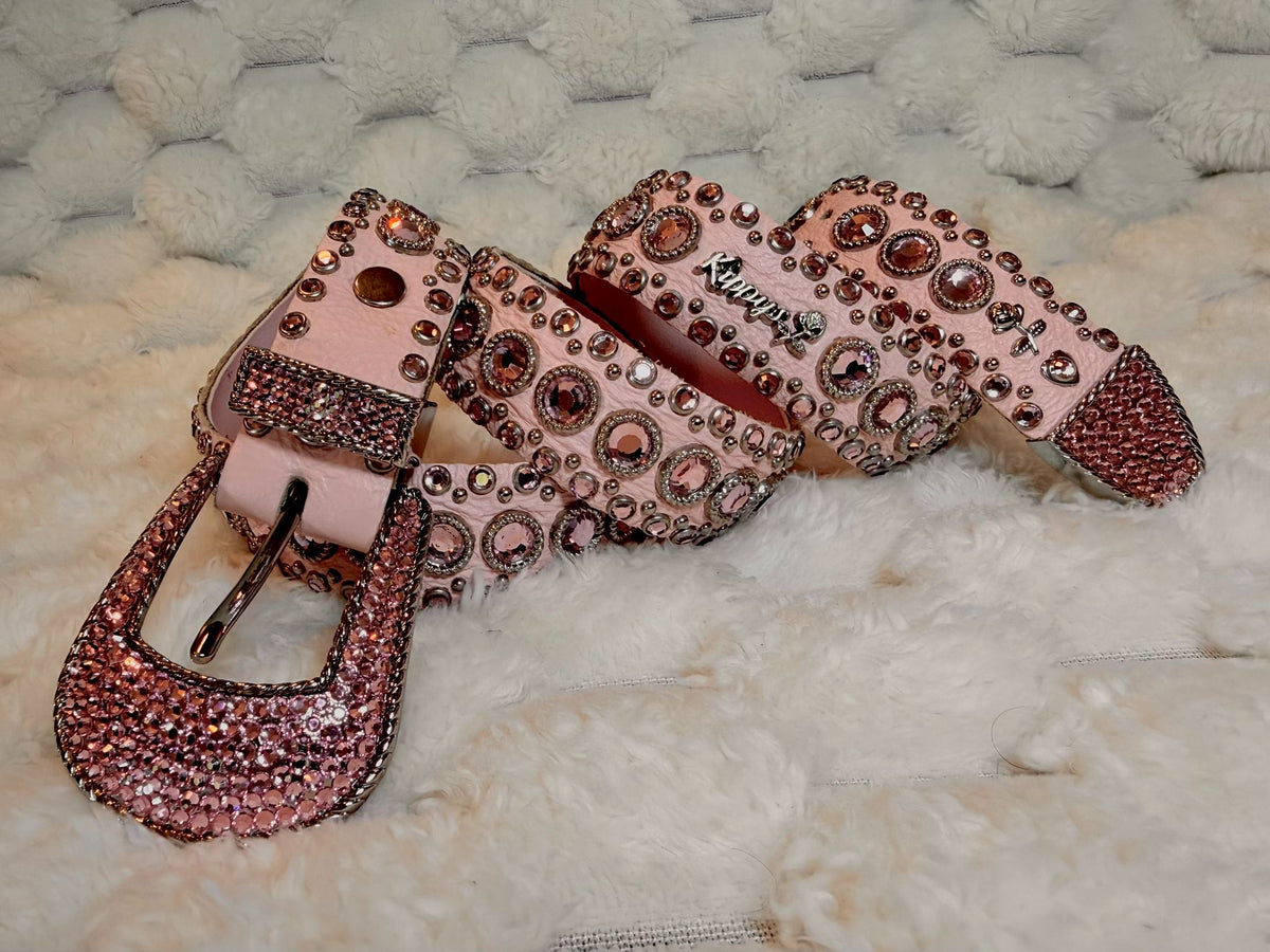 Vintage Kippy’s pink leather Swarovski crystal belt with pink rhinestones, silver hardware and crystal-covered buckle.