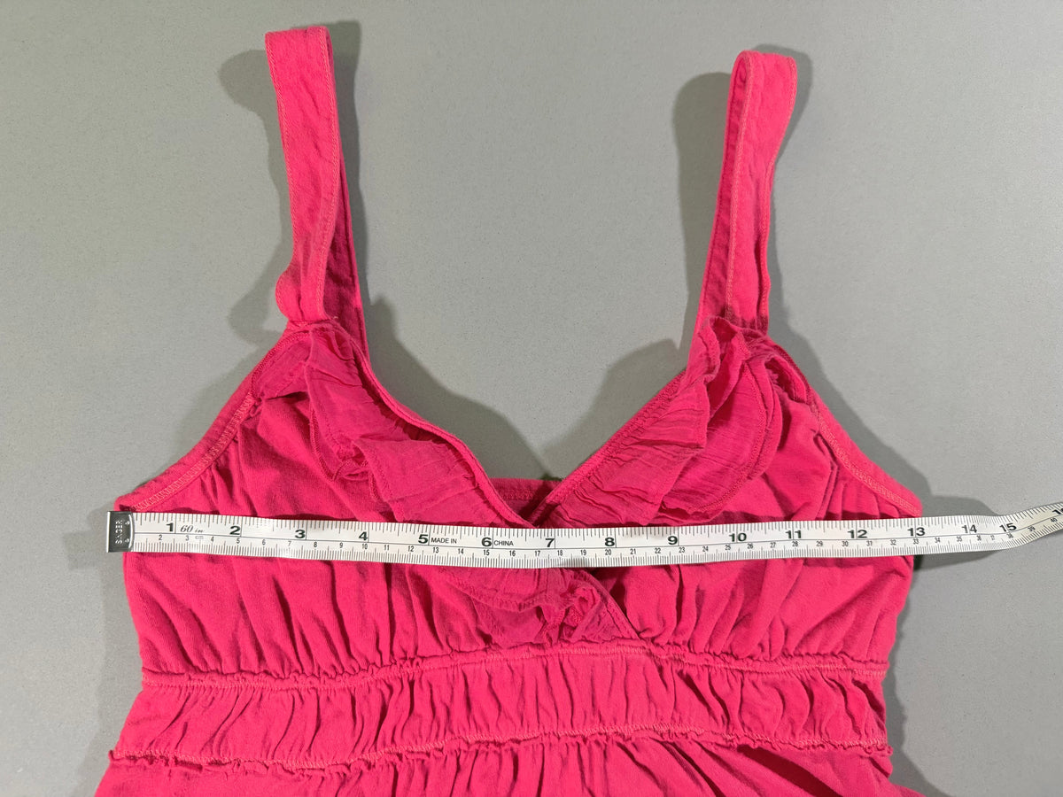 Bust measurement shown across the front of the vintage coral pink Hollister babydoll tank top.